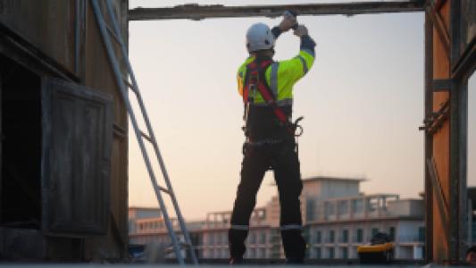a steel worker cutting steel