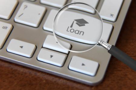 magnifying glass on a student loan icon