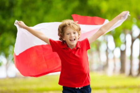 child running while carrying a Poland flag