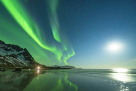 green northern lights on the night sky