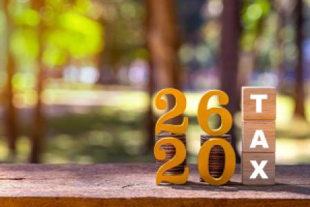 2026 tax wooden blocks on an outdoor table