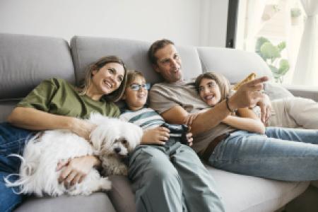 a family relaxing on the sofa