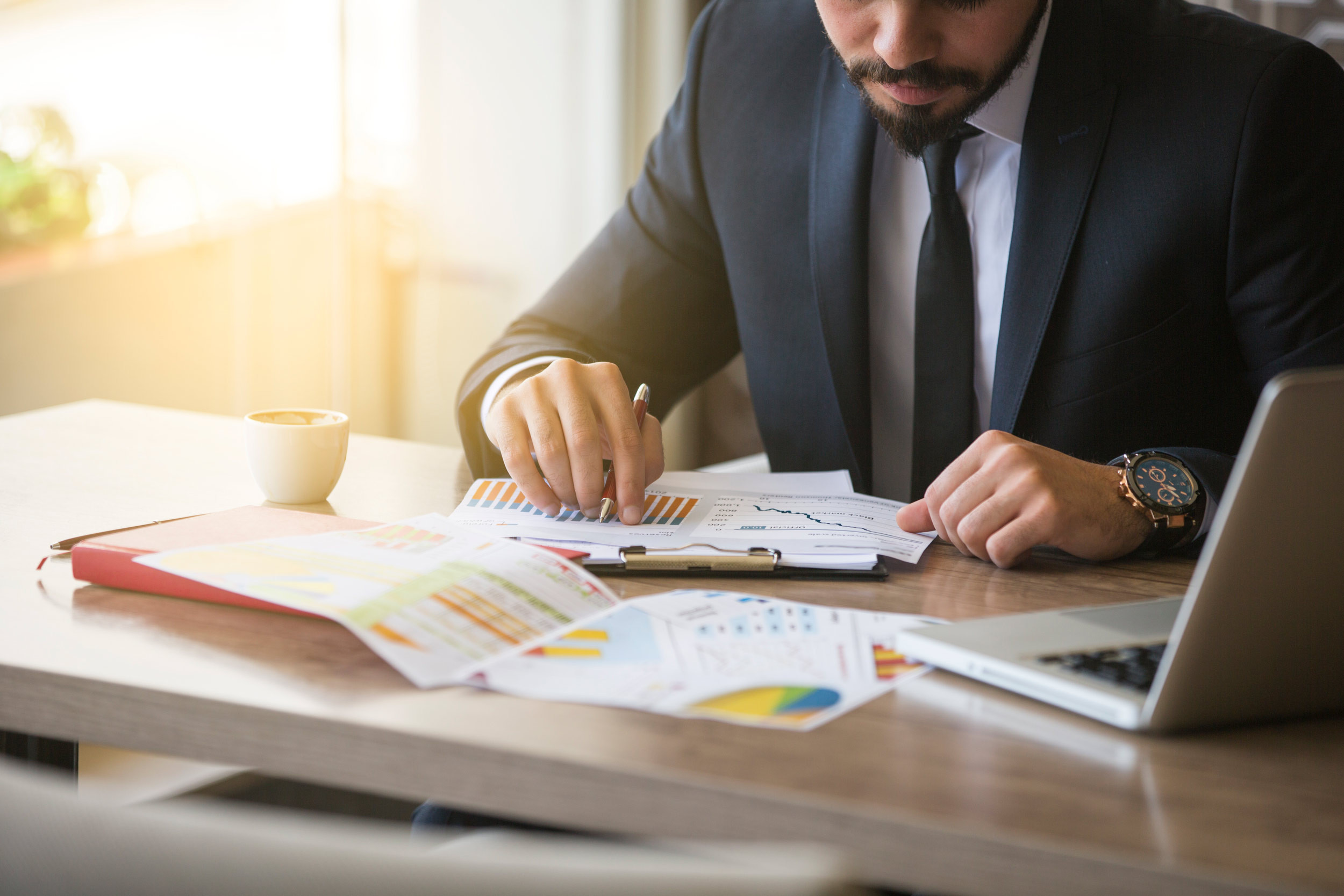 An accountant analyzes data at his desk