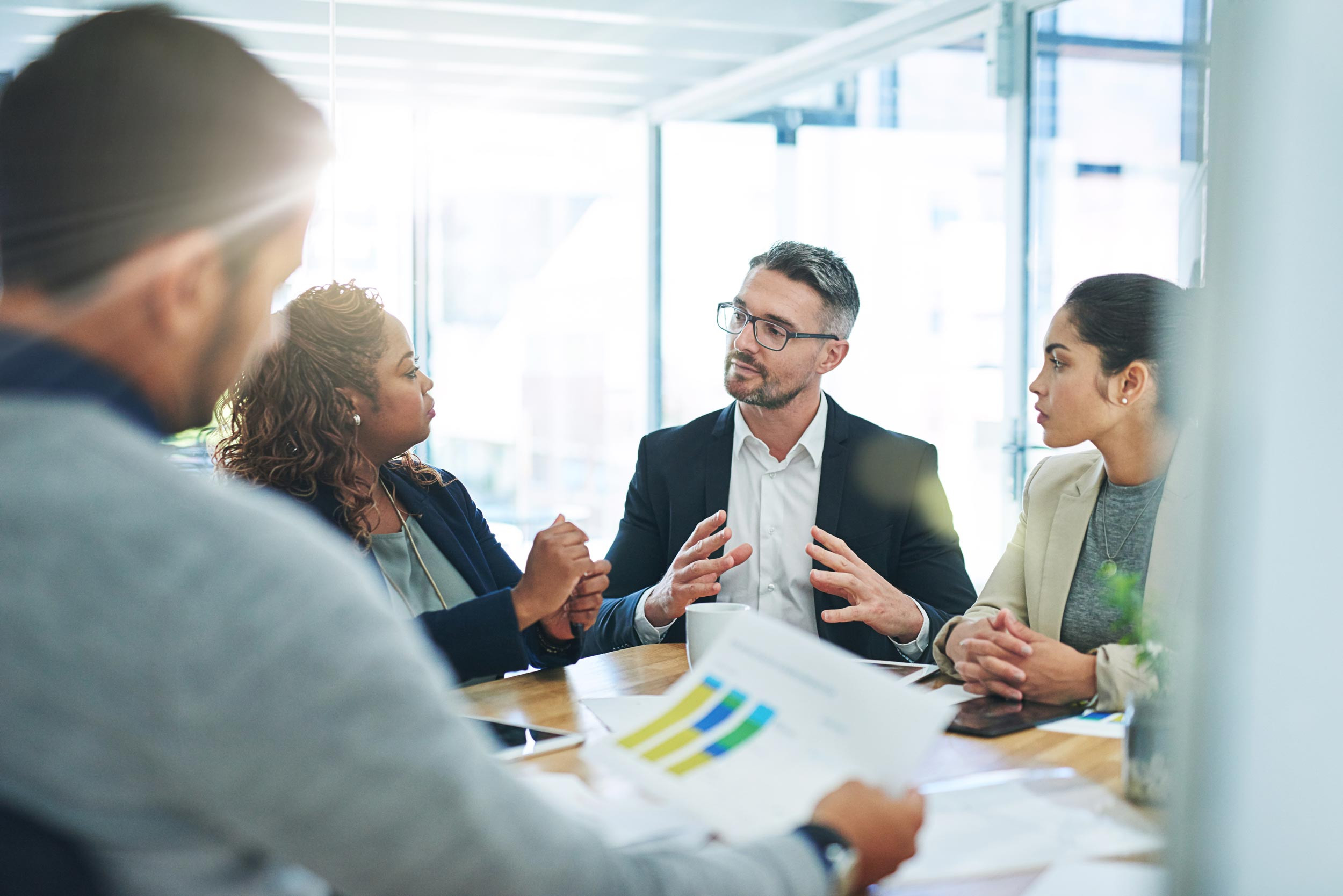 Coworkers engaged in a discussion during a business conference