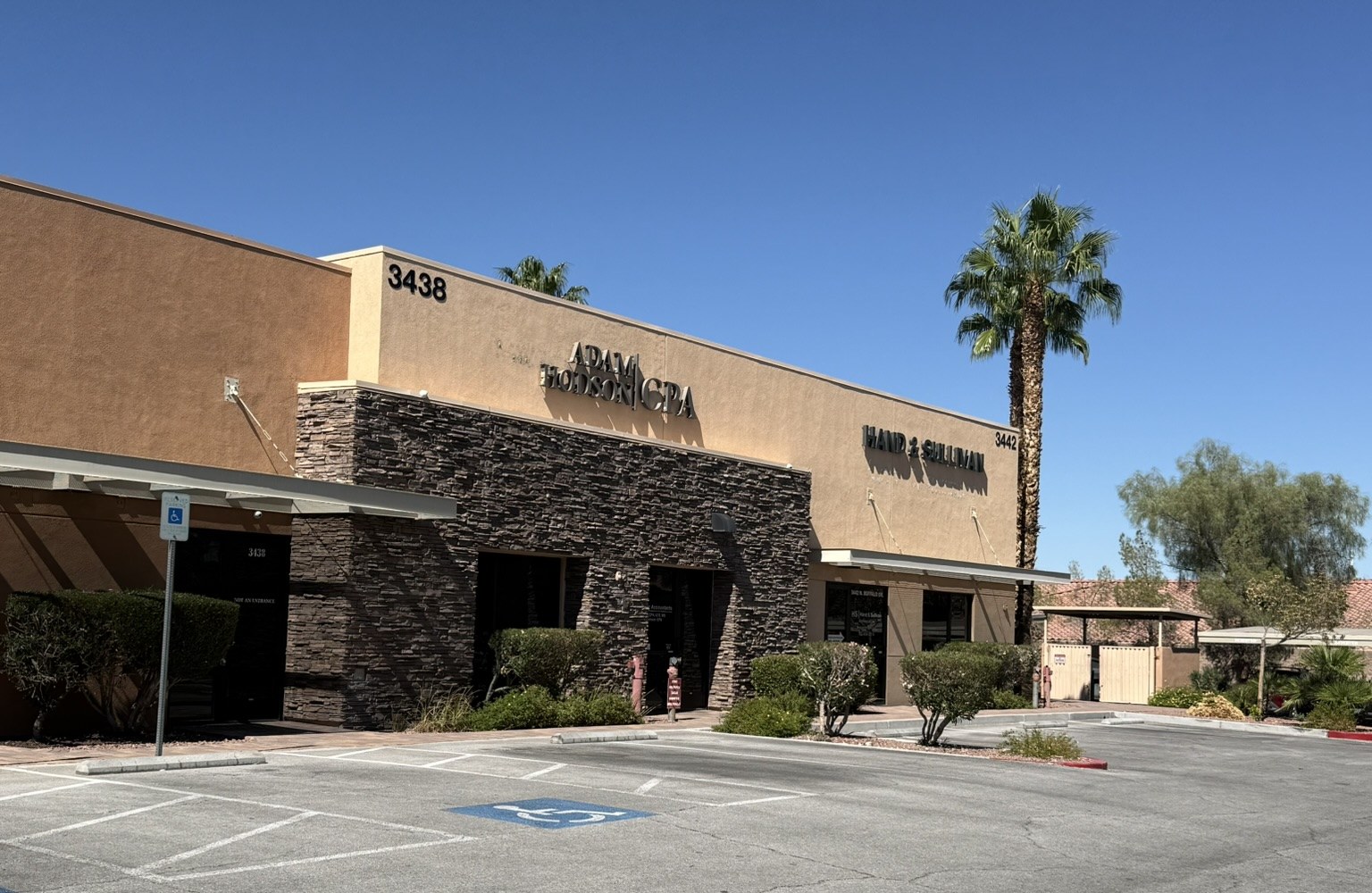 The office building as seen from the parking lot, with parking in front