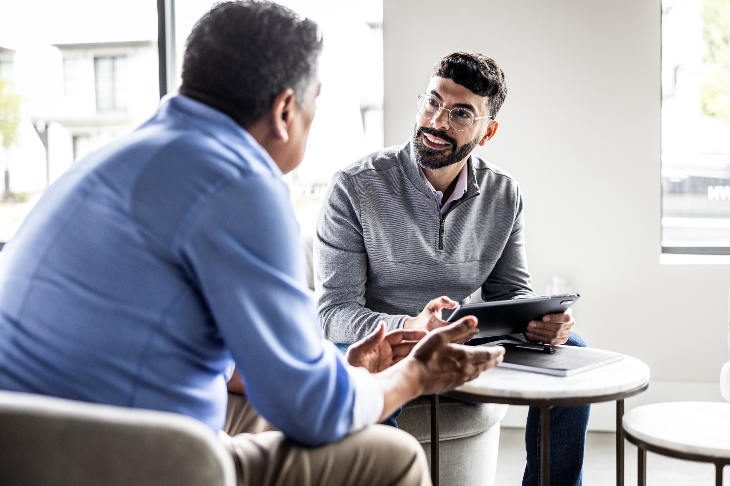 client speaking to consultant in an office