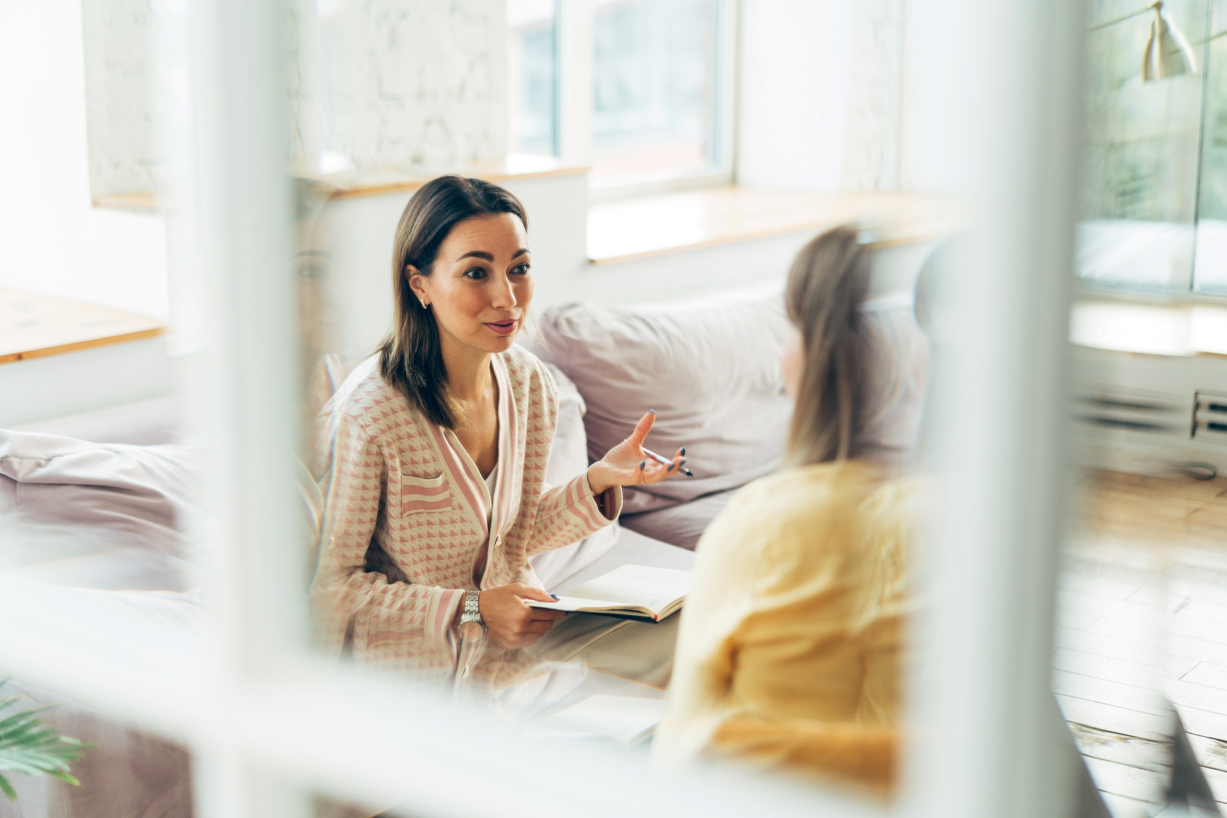 two women in armchairs having a consultation