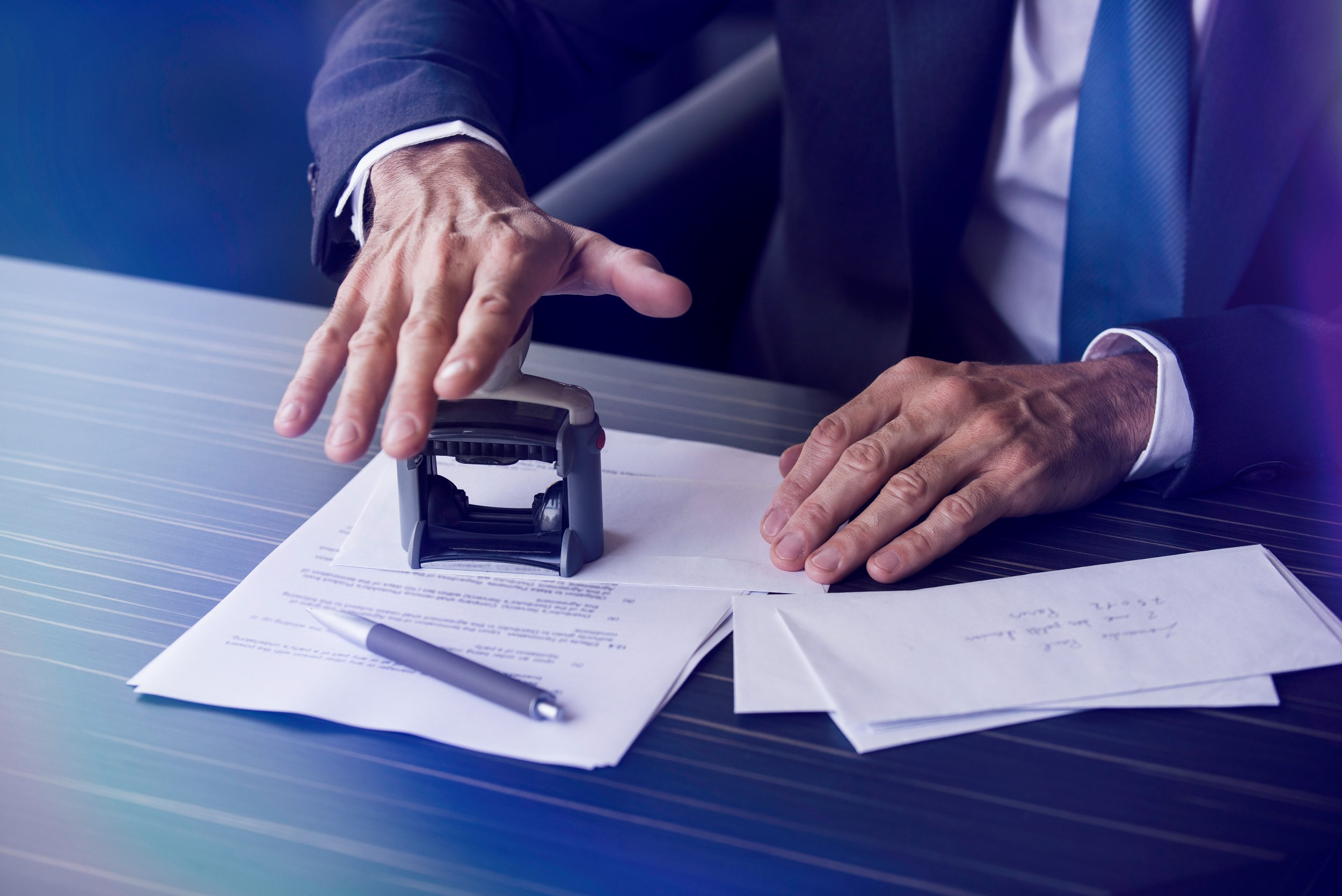 a notary stamping a document for approval