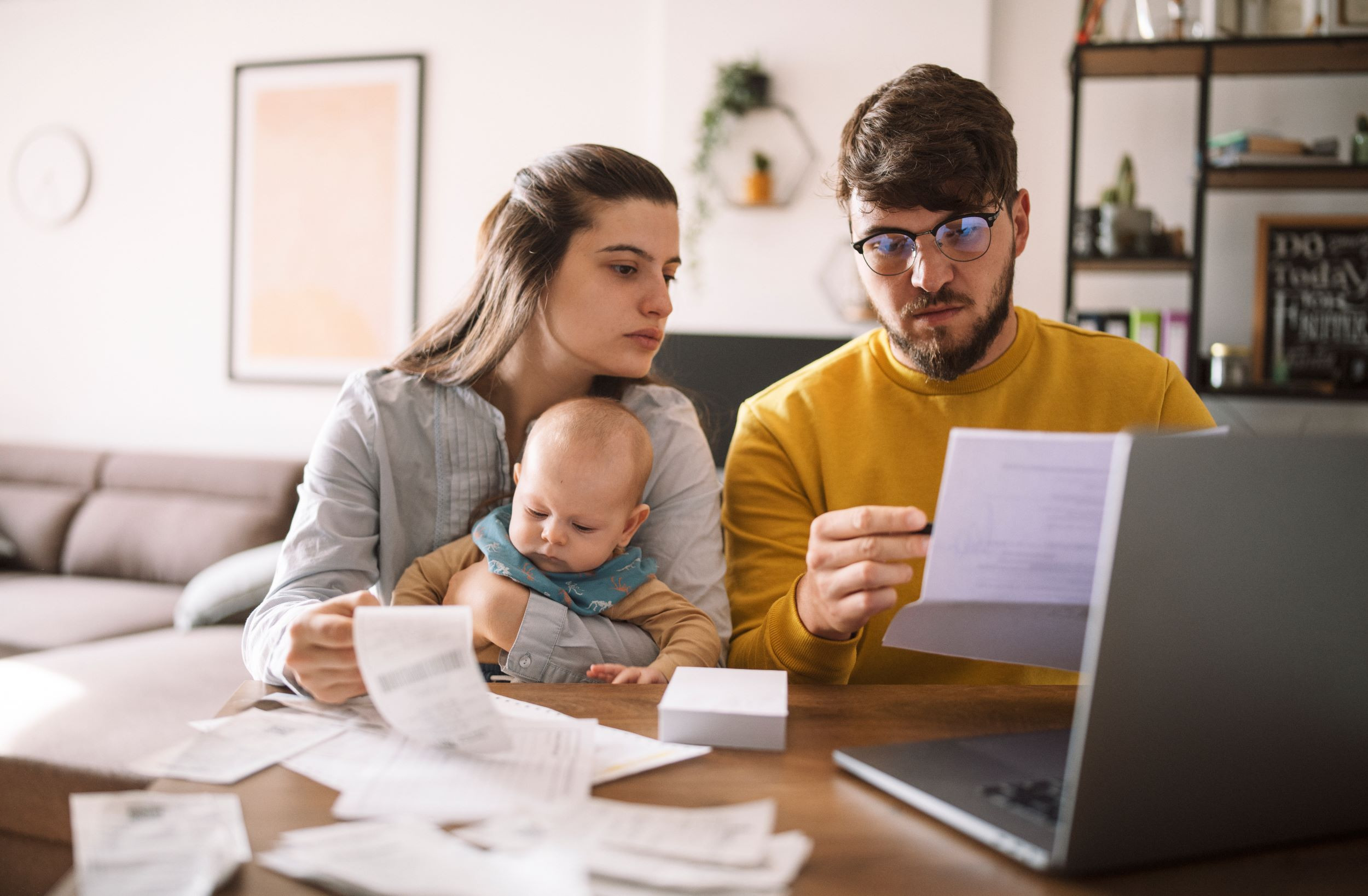 a family figuring out bills and taxes at home