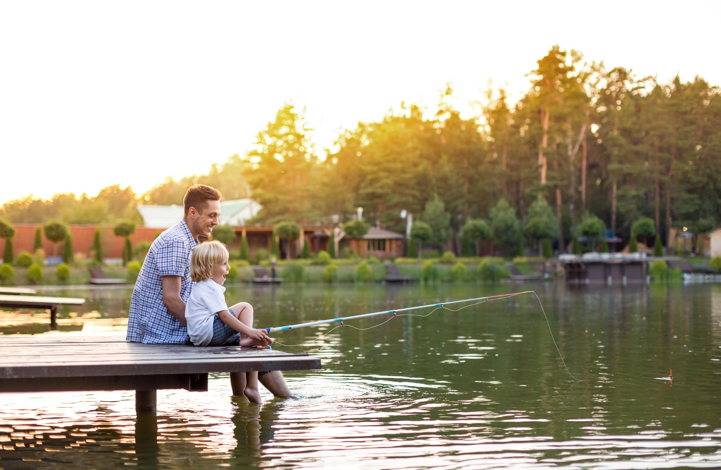 Father and child fishing, representing the peace of mind from financial stability