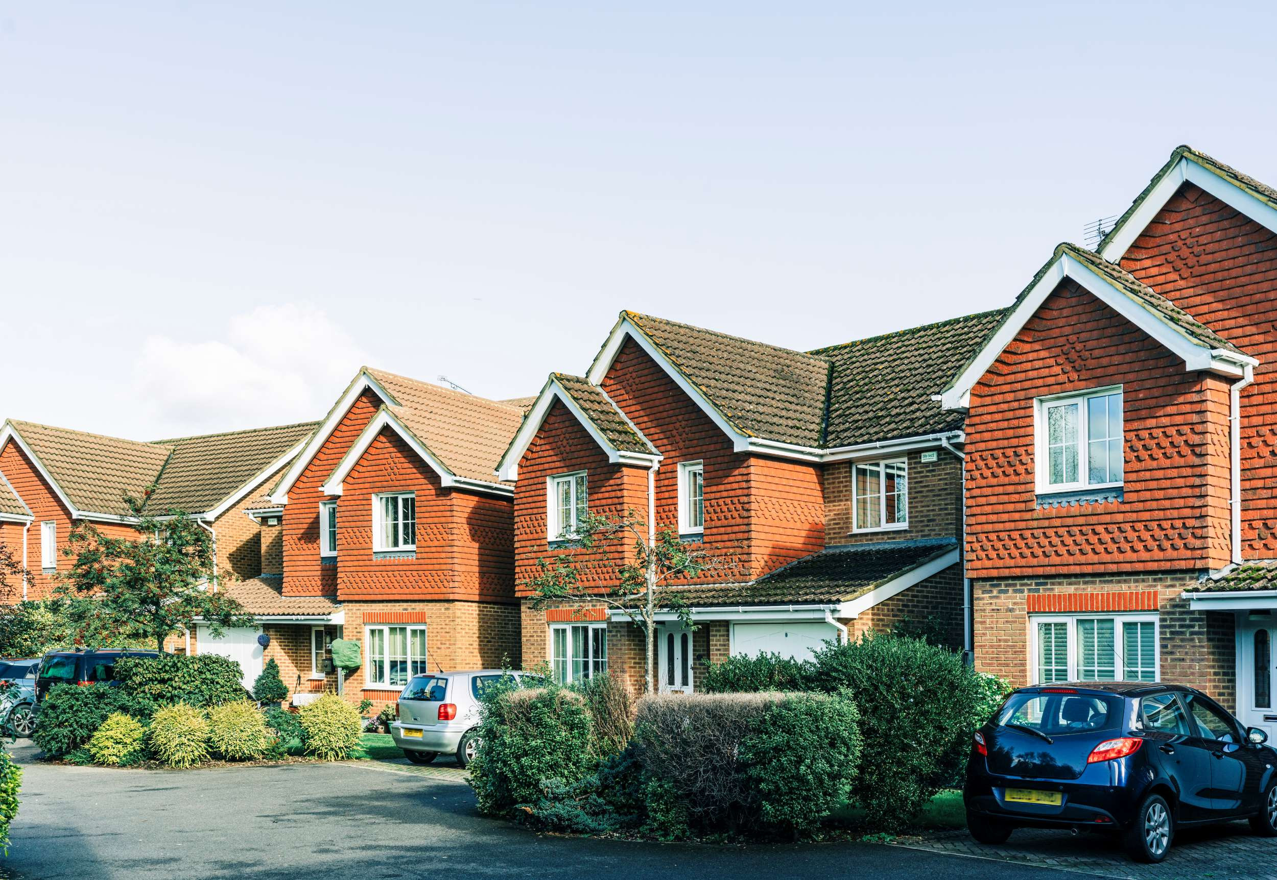 a row of brick houses in a quaint neighborhood