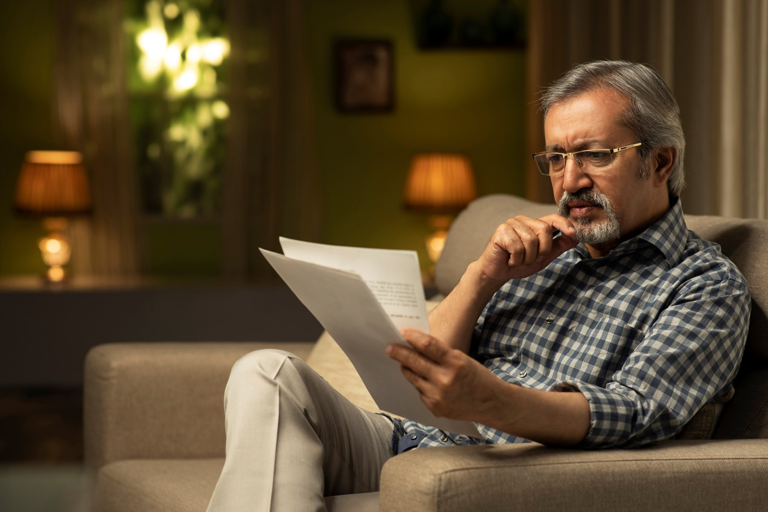 a man worried about getting bad news from a letter