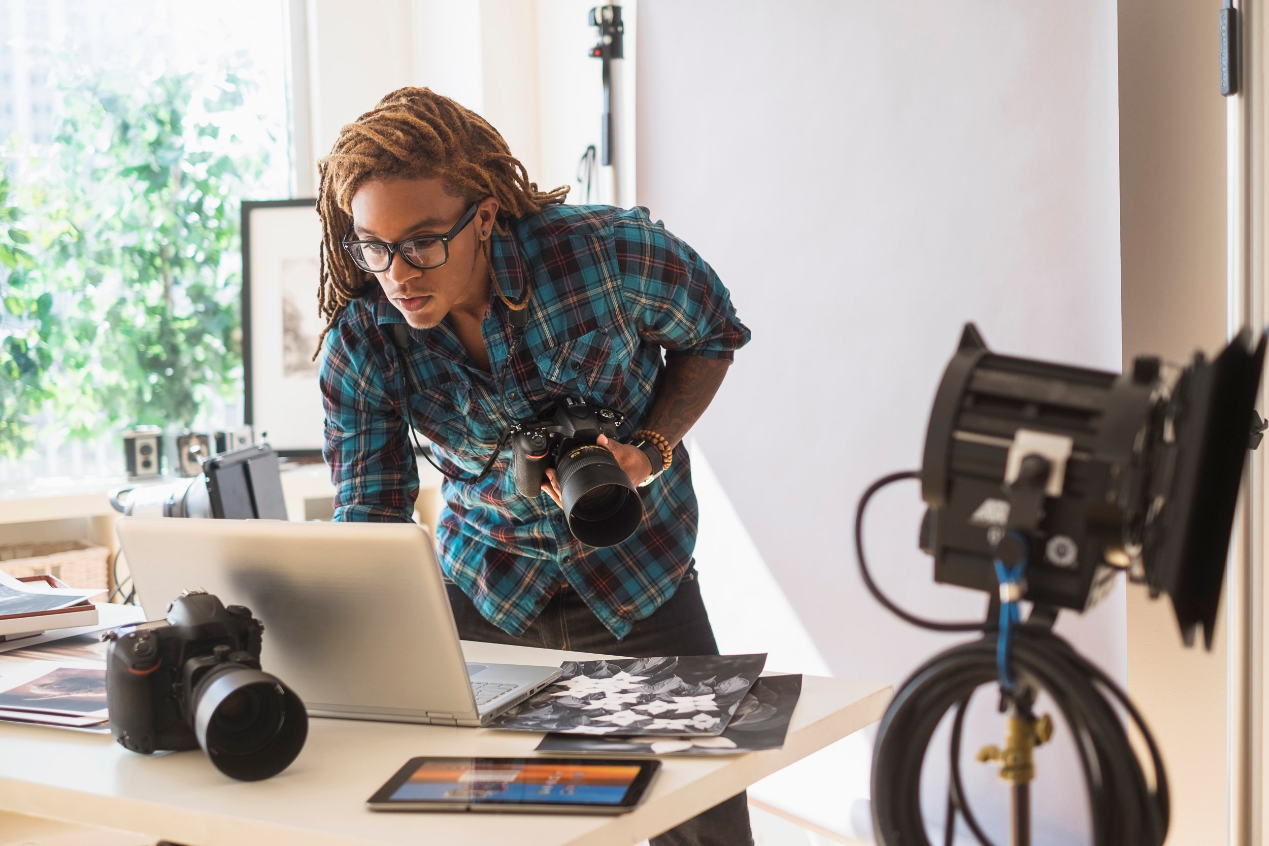 a freelance photographer working in his studio