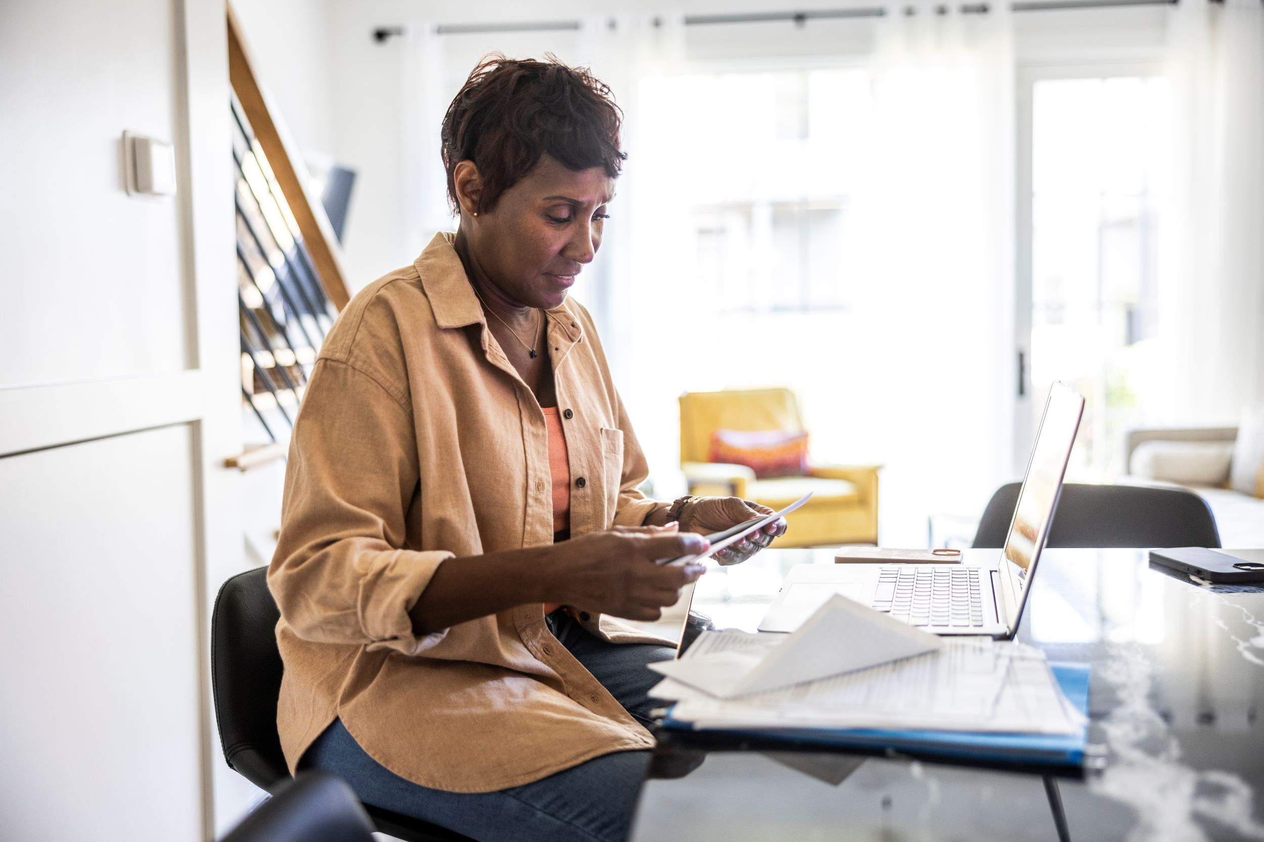 a senior woman planning for retirement at home
