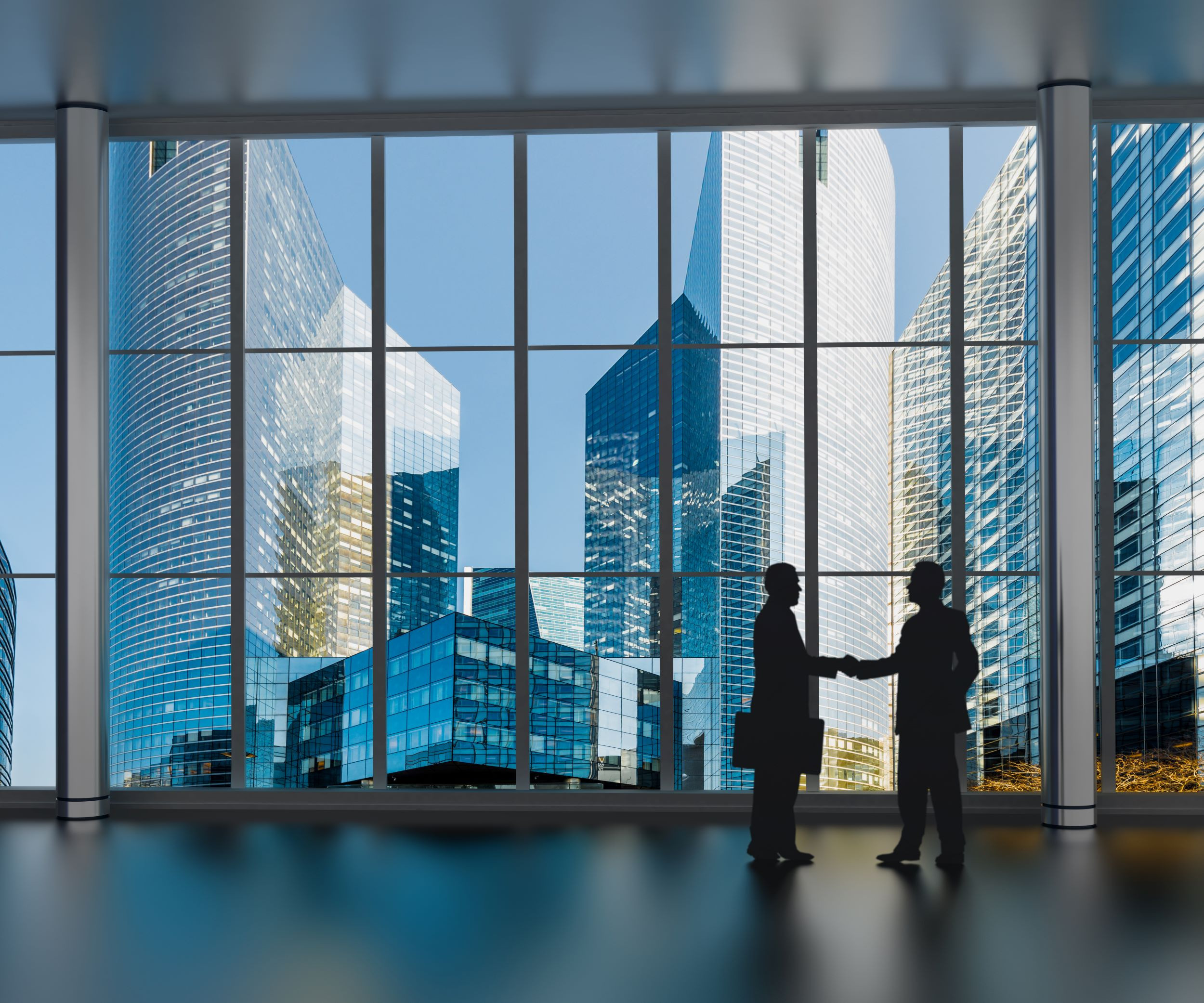 businessmen shaking hands with a cityscape background