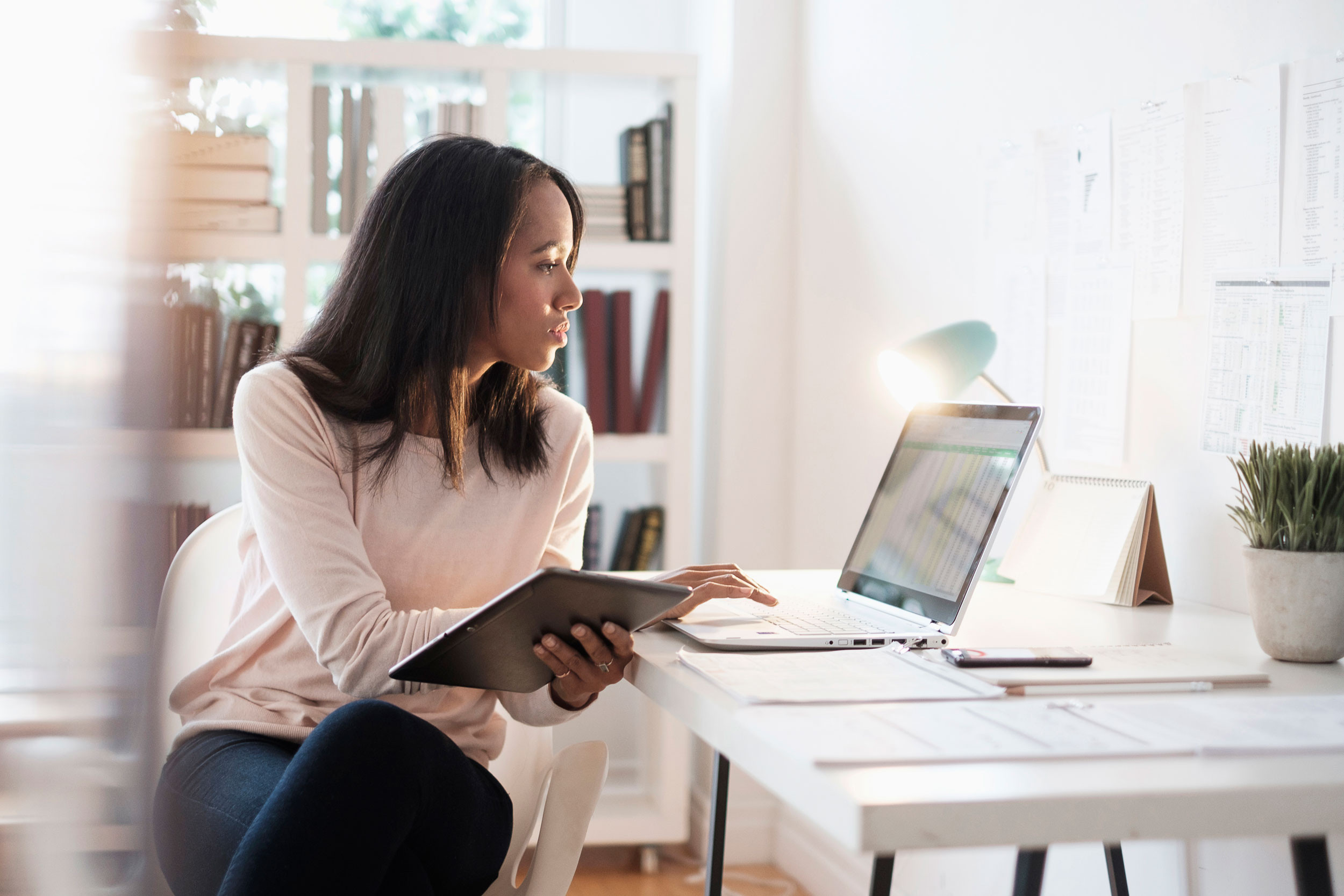 a bookkeeper working on a laptop