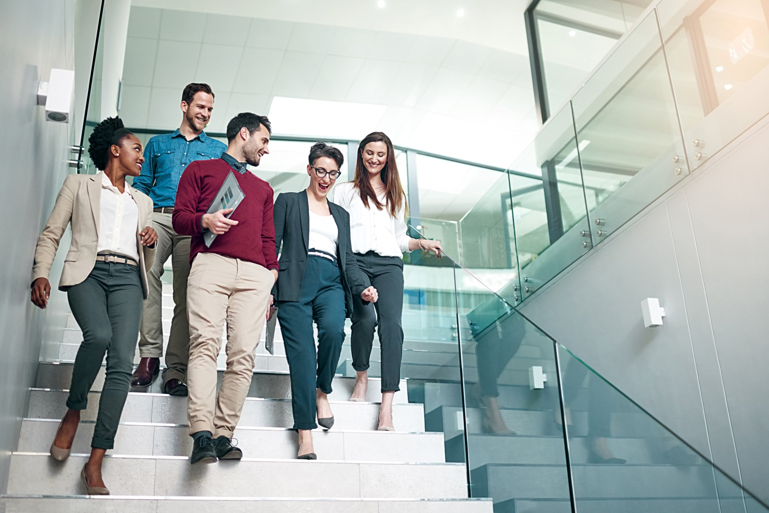 a successful business team walking down the stairs