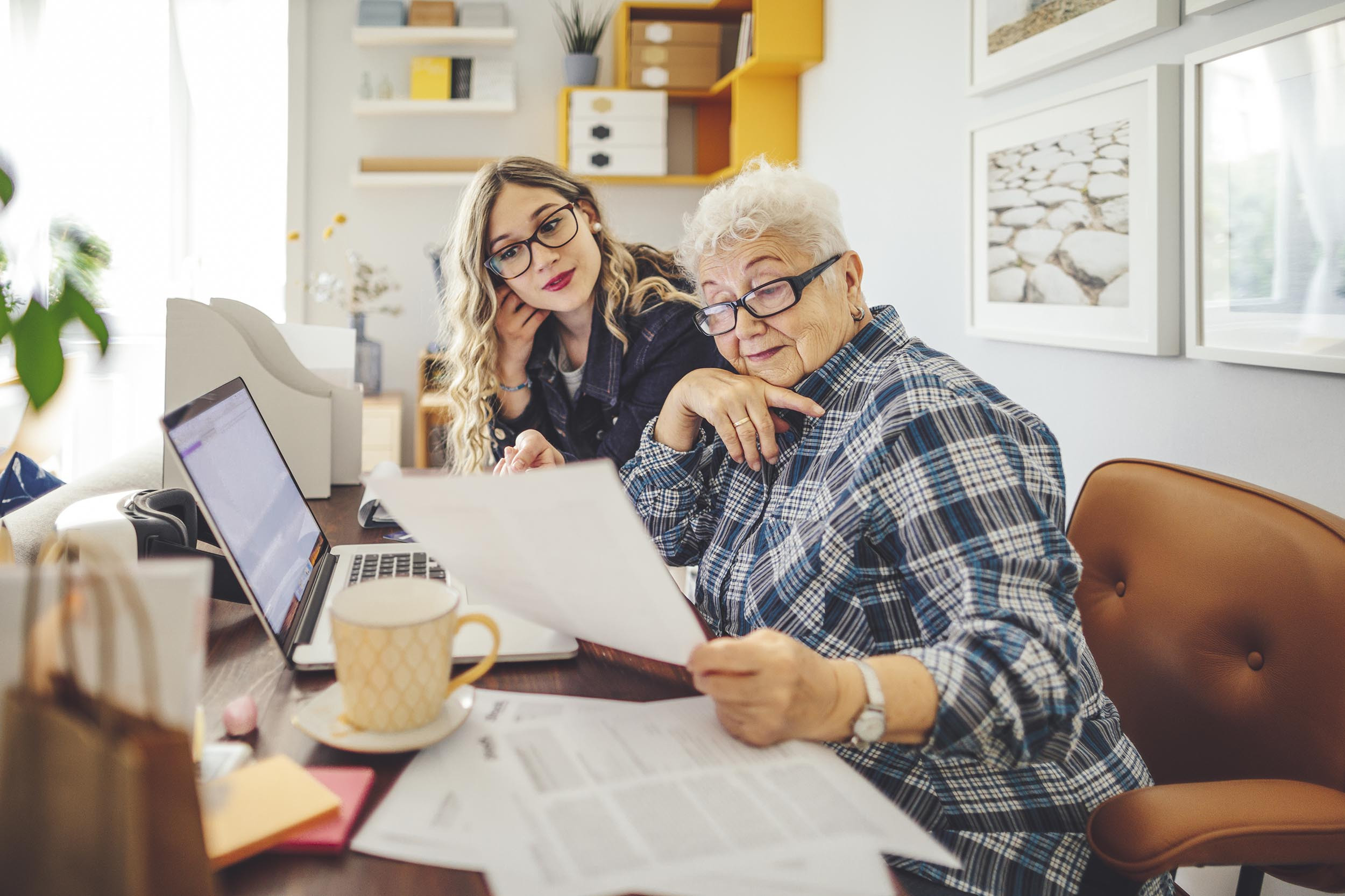 a woman and her grandmother doing taxes