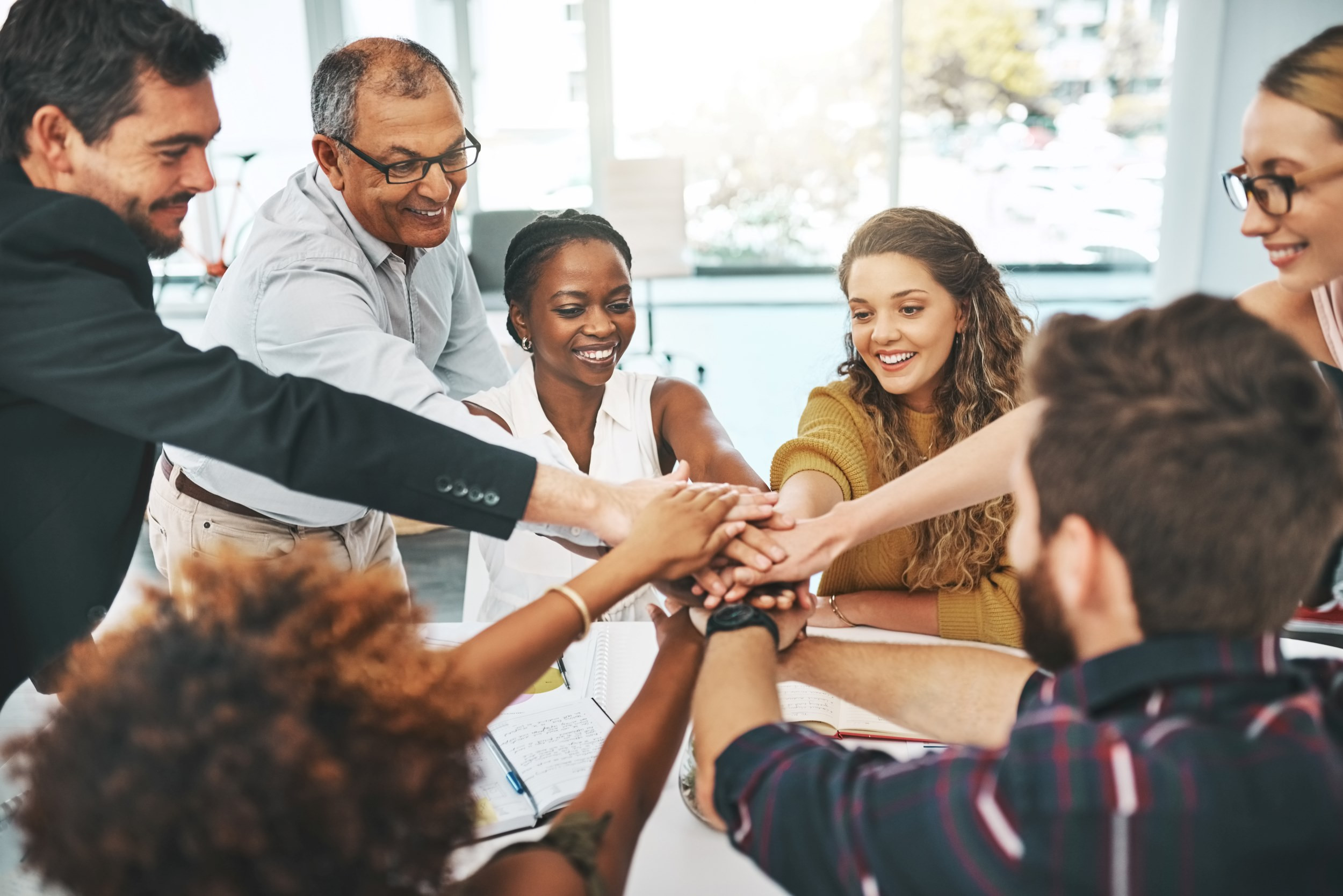 a business team putting hands together
