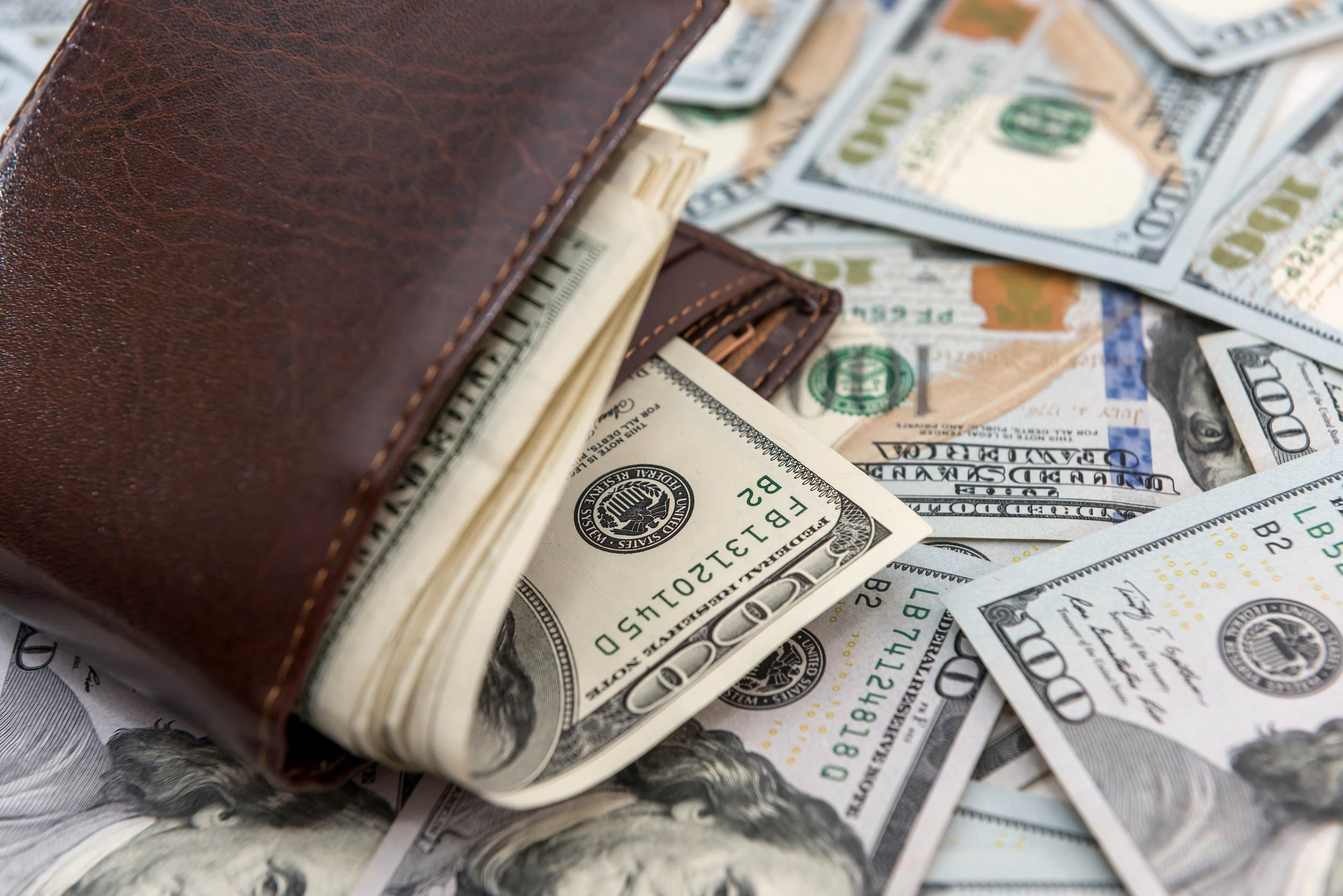 a wallet full of dollar bills