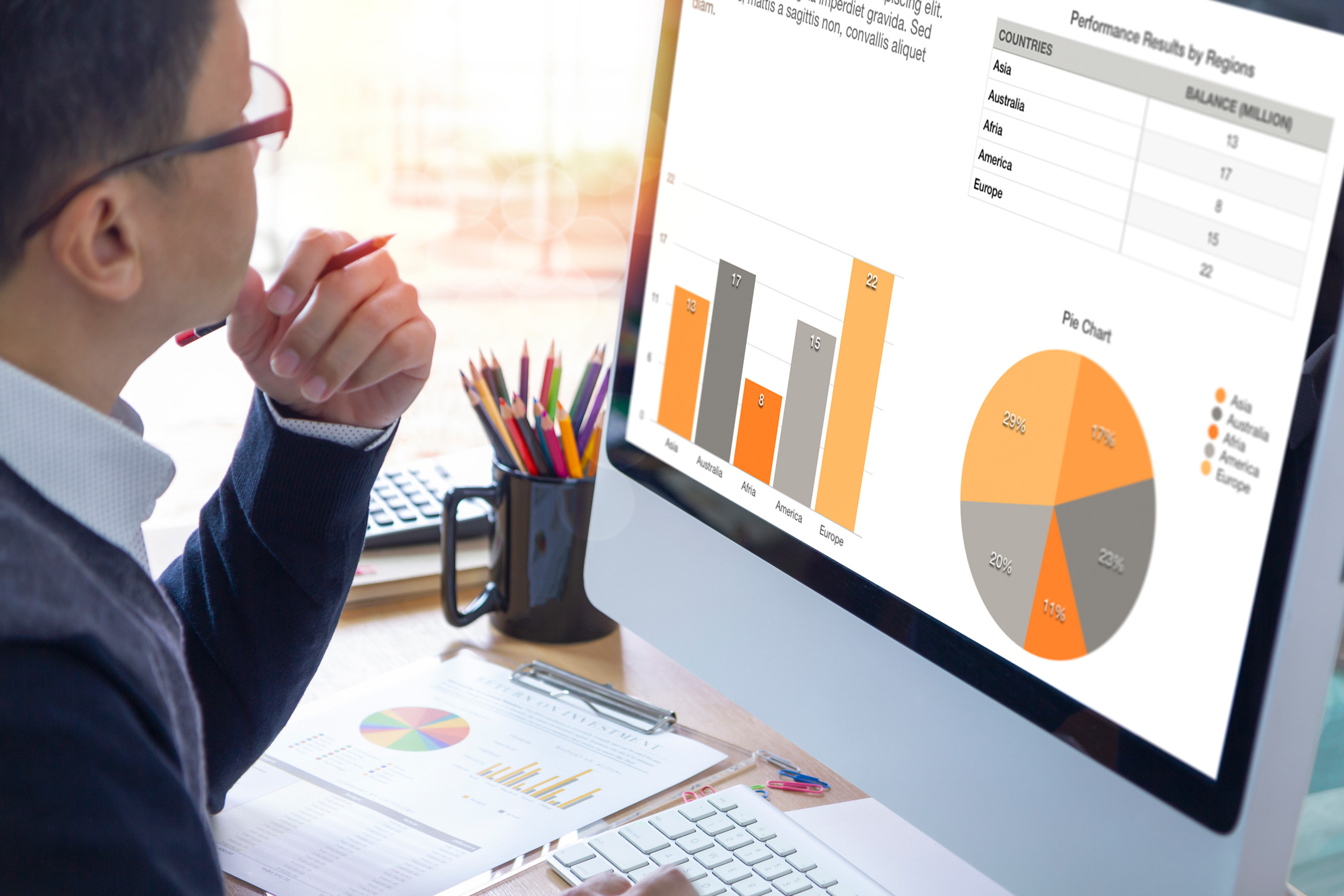 businessperson reviewing the graph in the computer