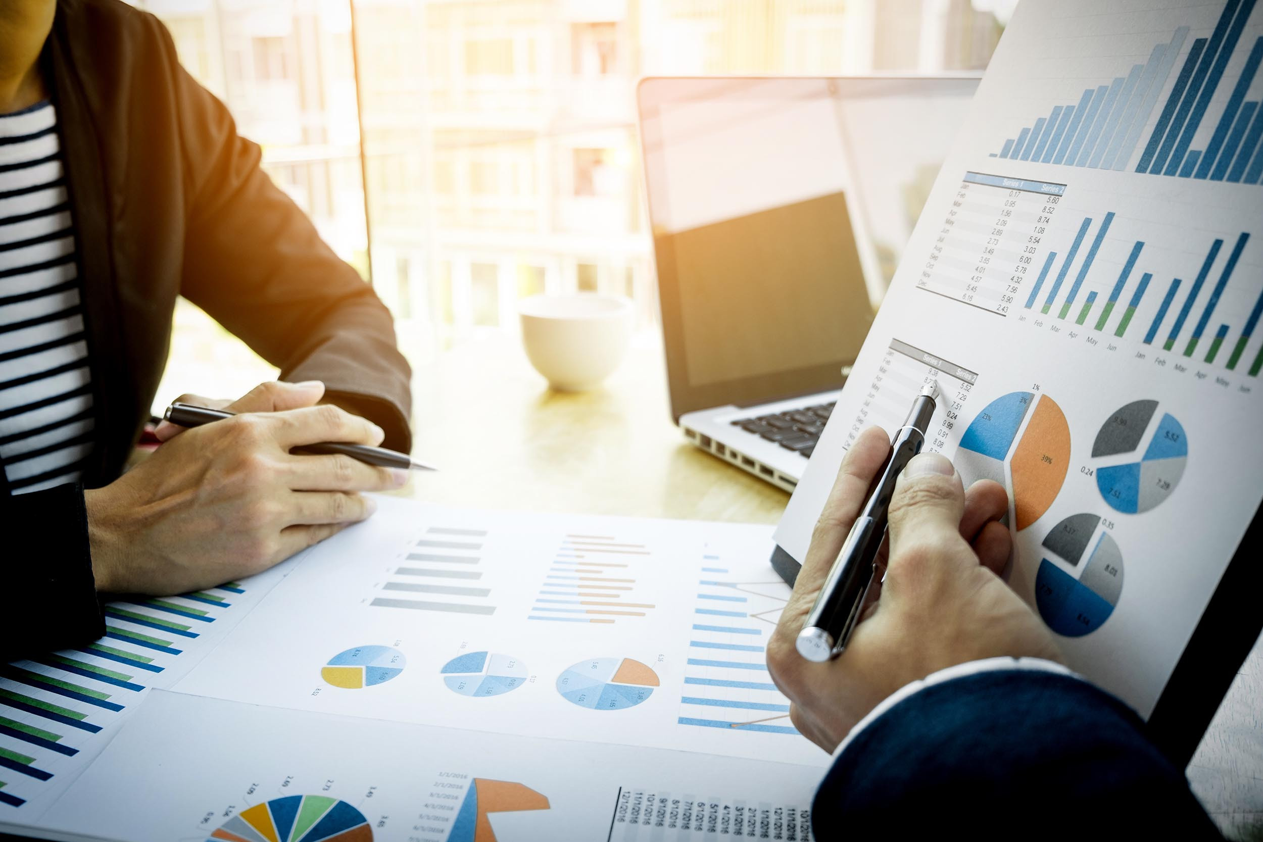 two people discussing with the yearly records