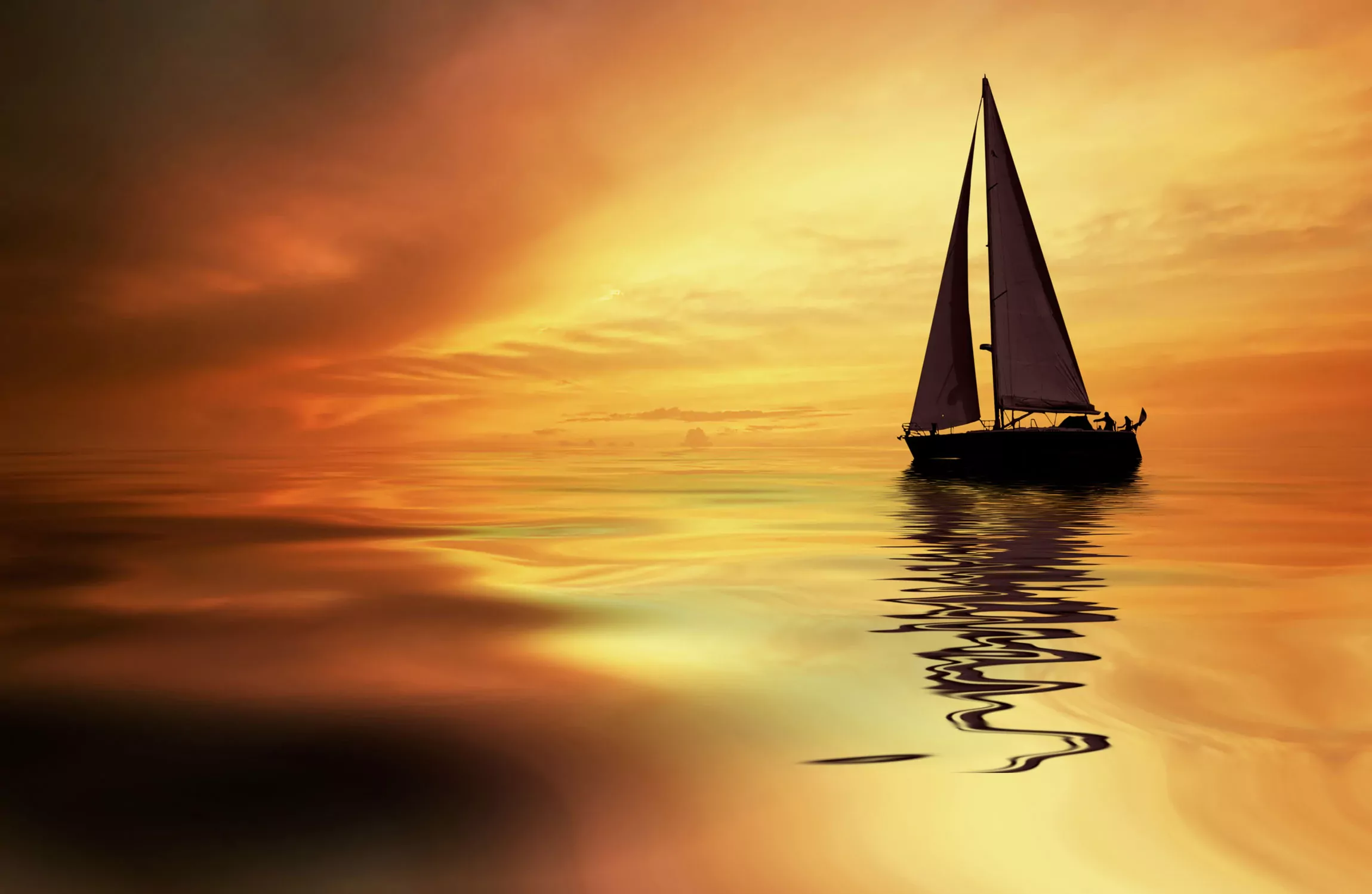 sunset at beach with sailboat