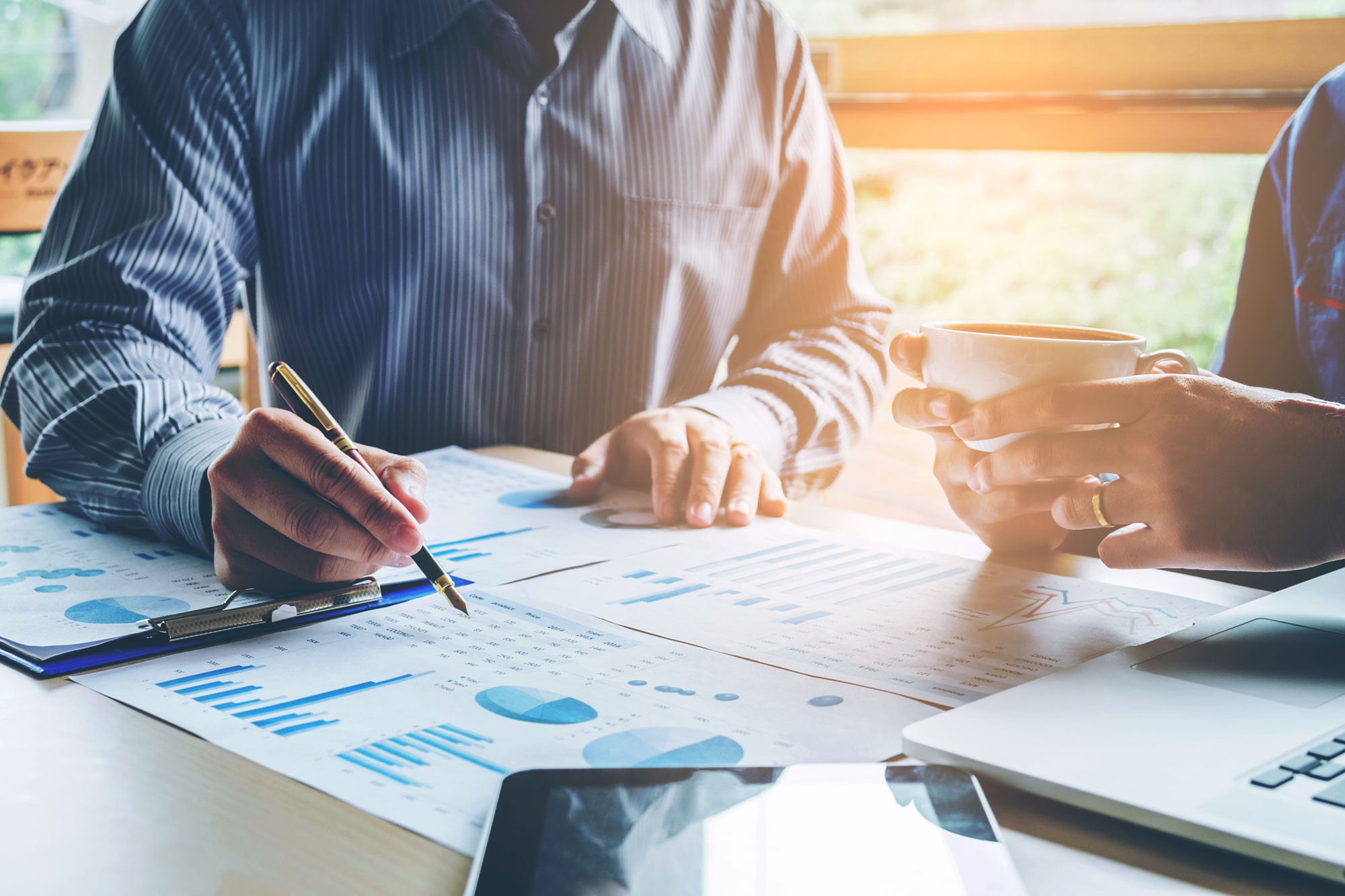 two person are in meeting with the financial report