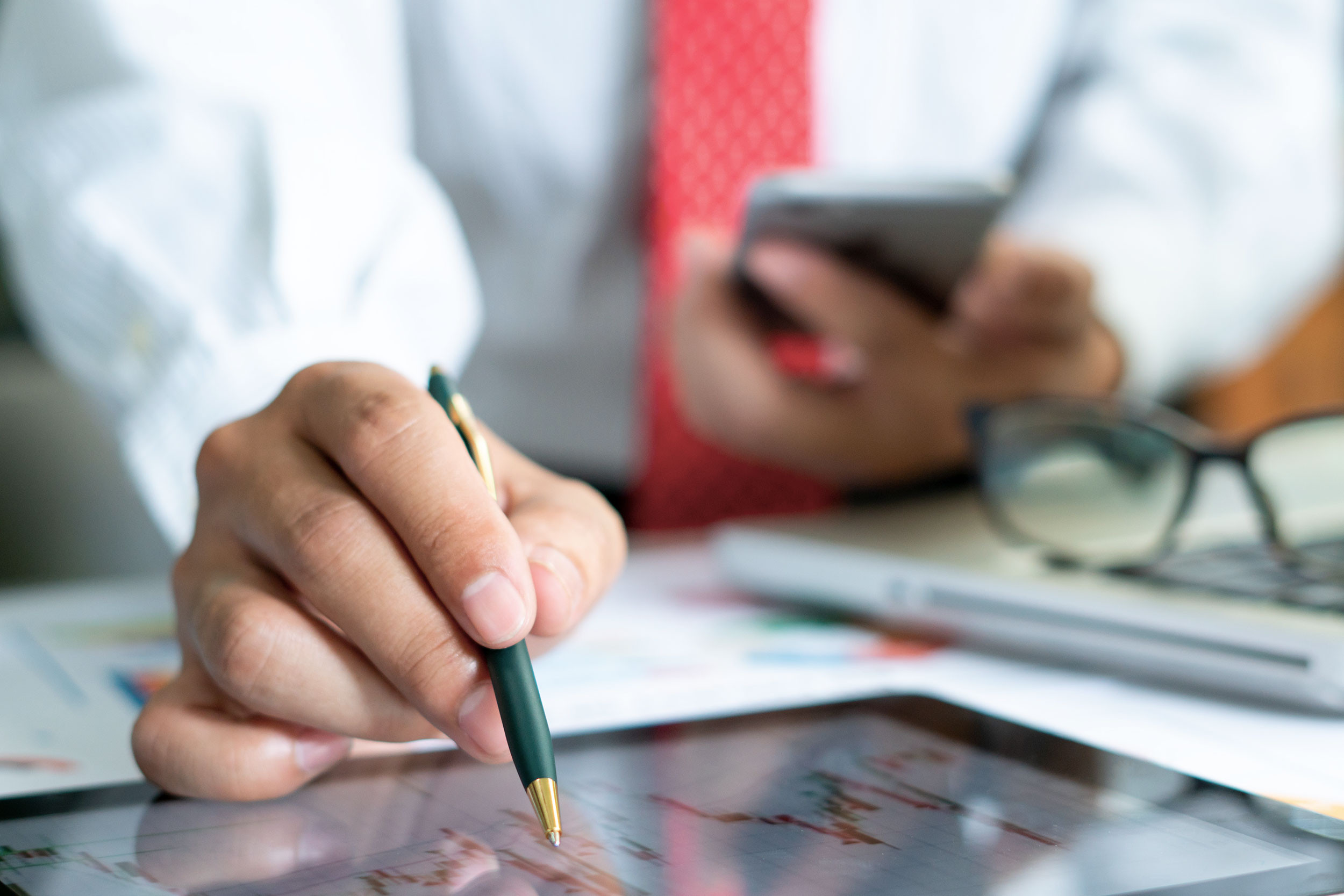 a person busy in analysis of financial report