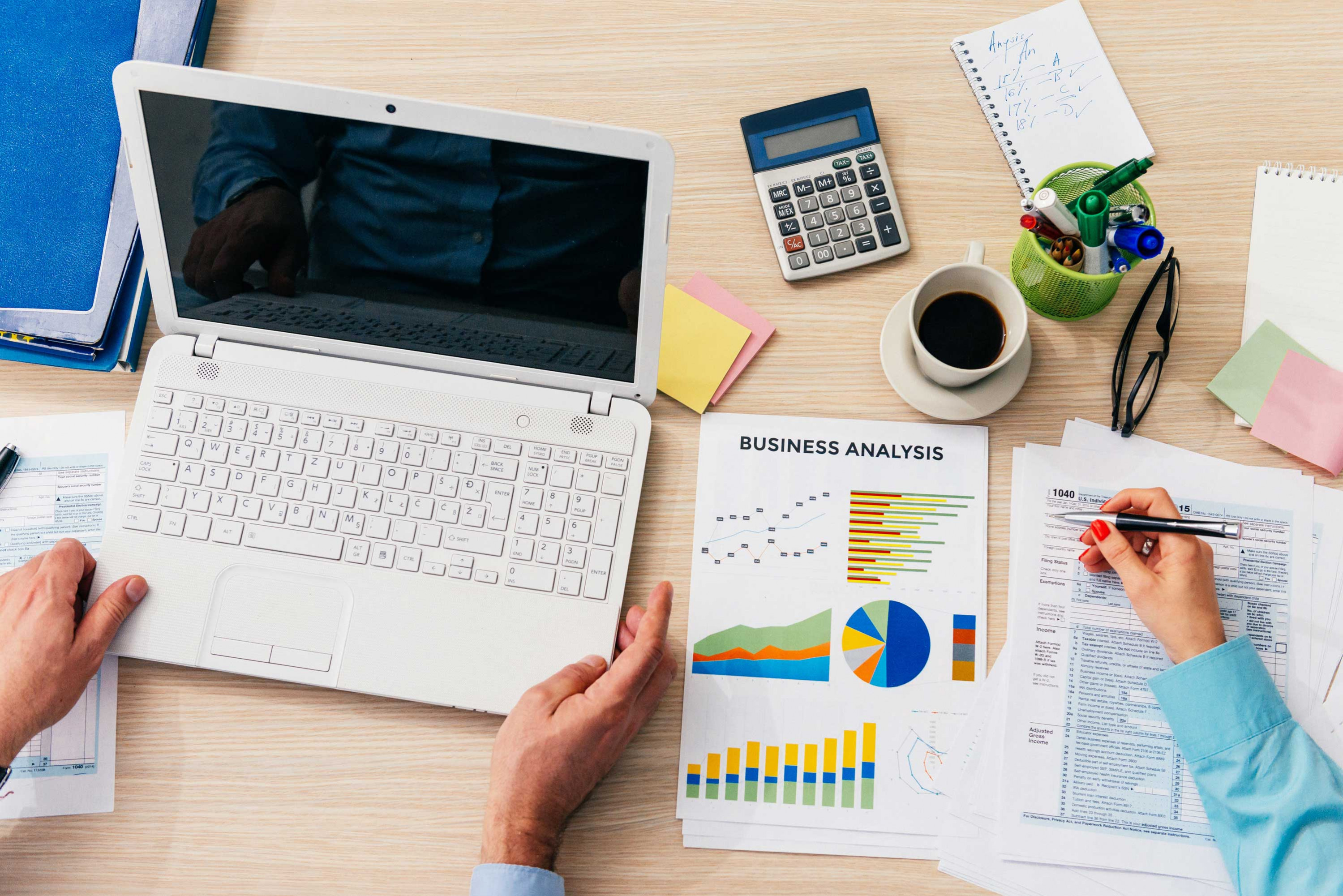 two persons discussing about business analysis report