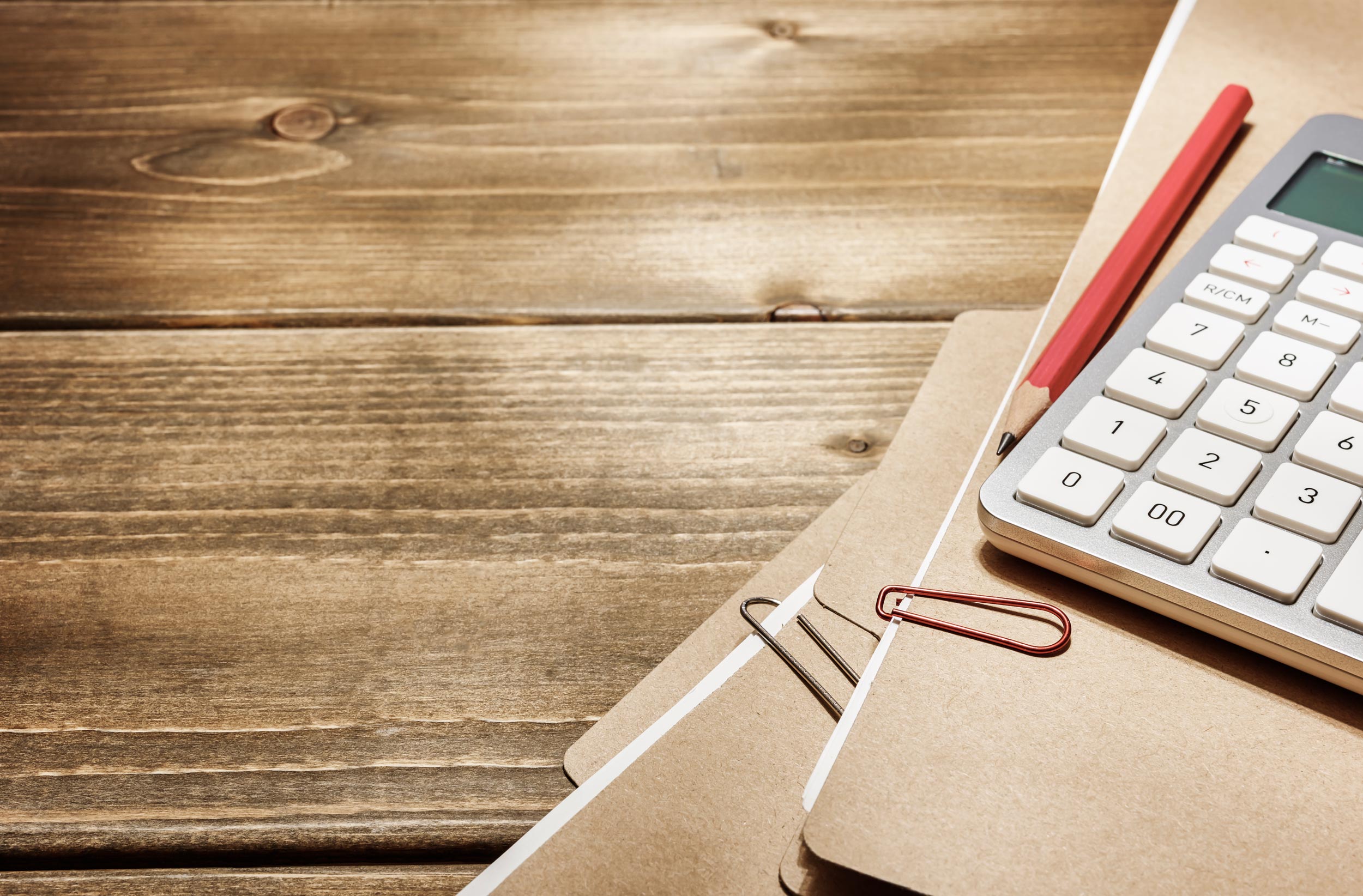 Tax documents and digital device on desk