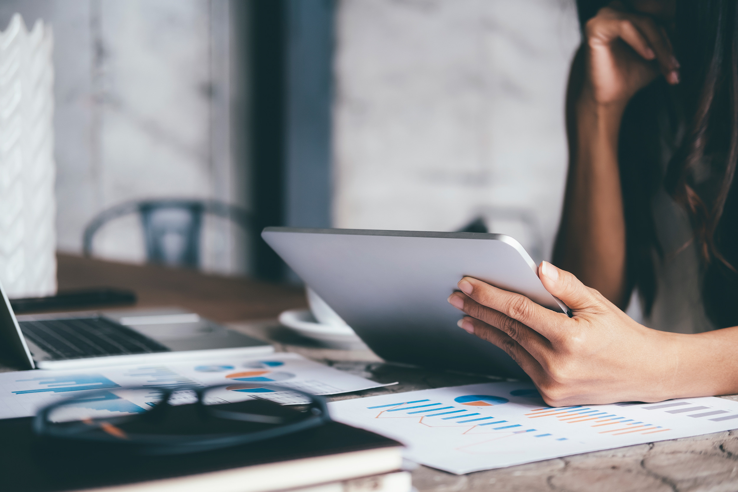a person checking business values in the tablet