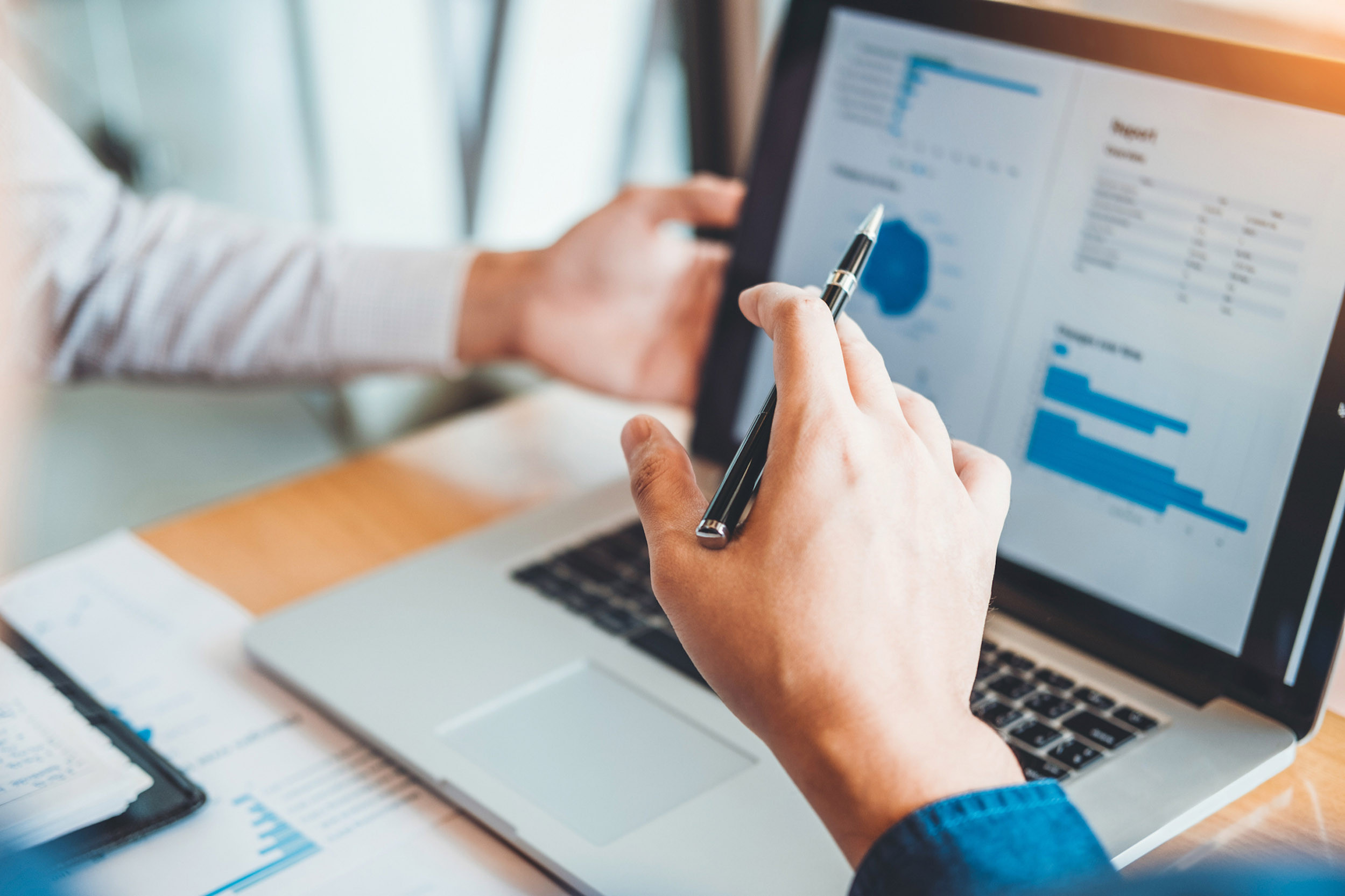 a group of people indicates finance in the laptop