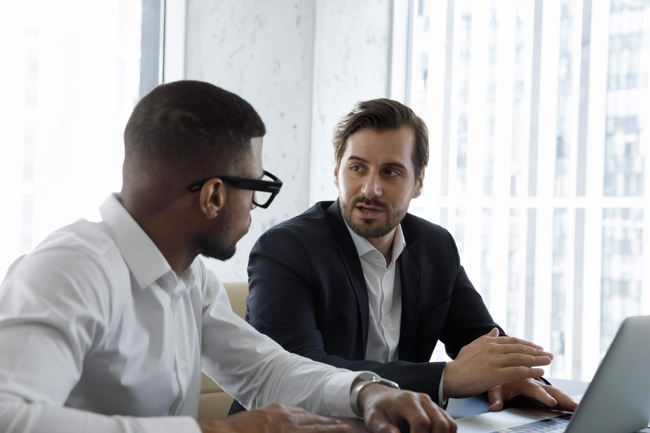 two peoples sharing the opinion to each other in the meeting