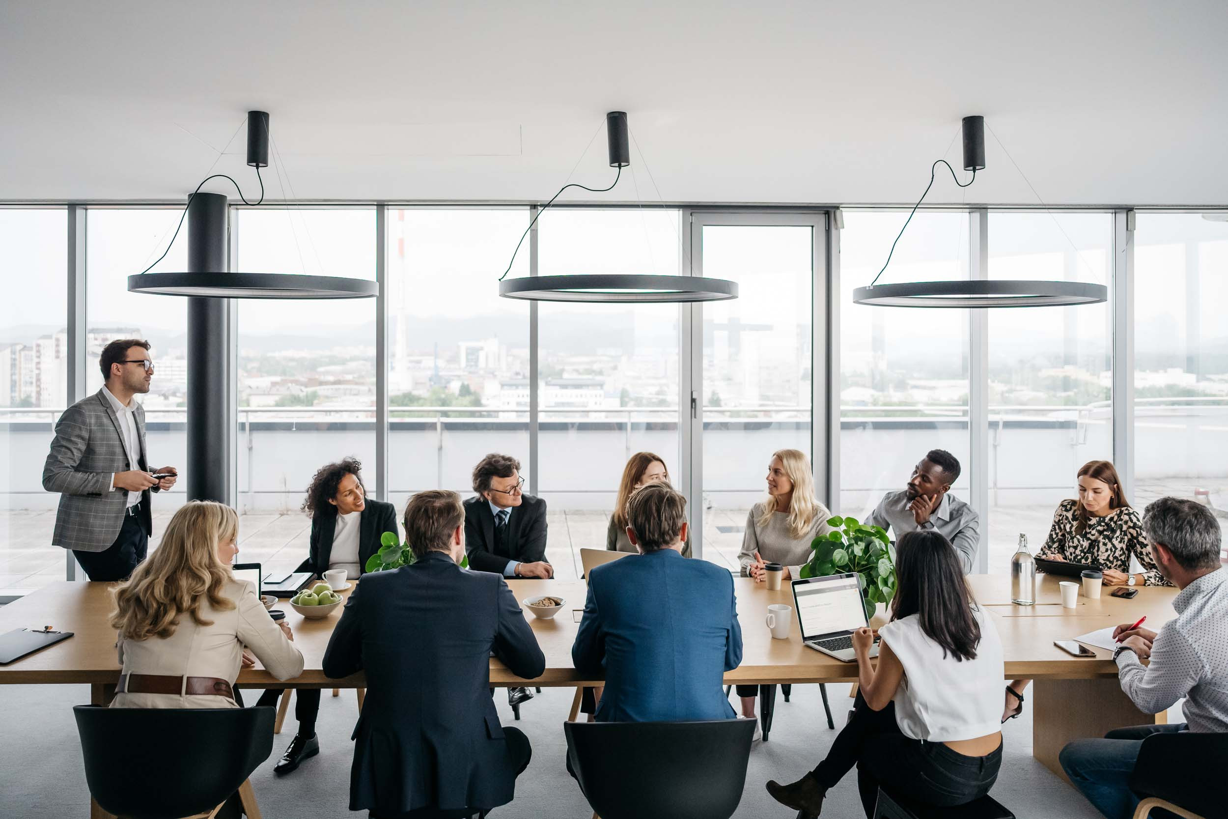 a person conducting the meeting session for the group of people