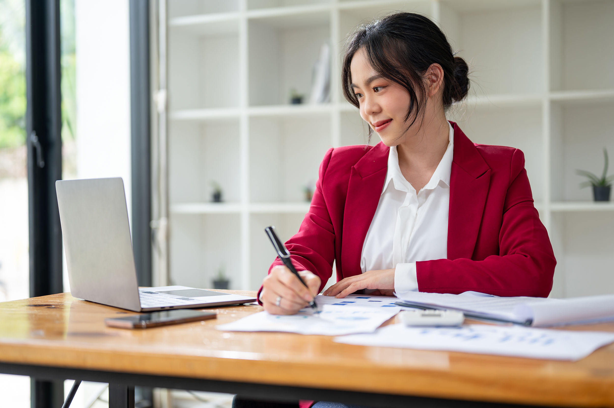 accountant working with documents and laptop