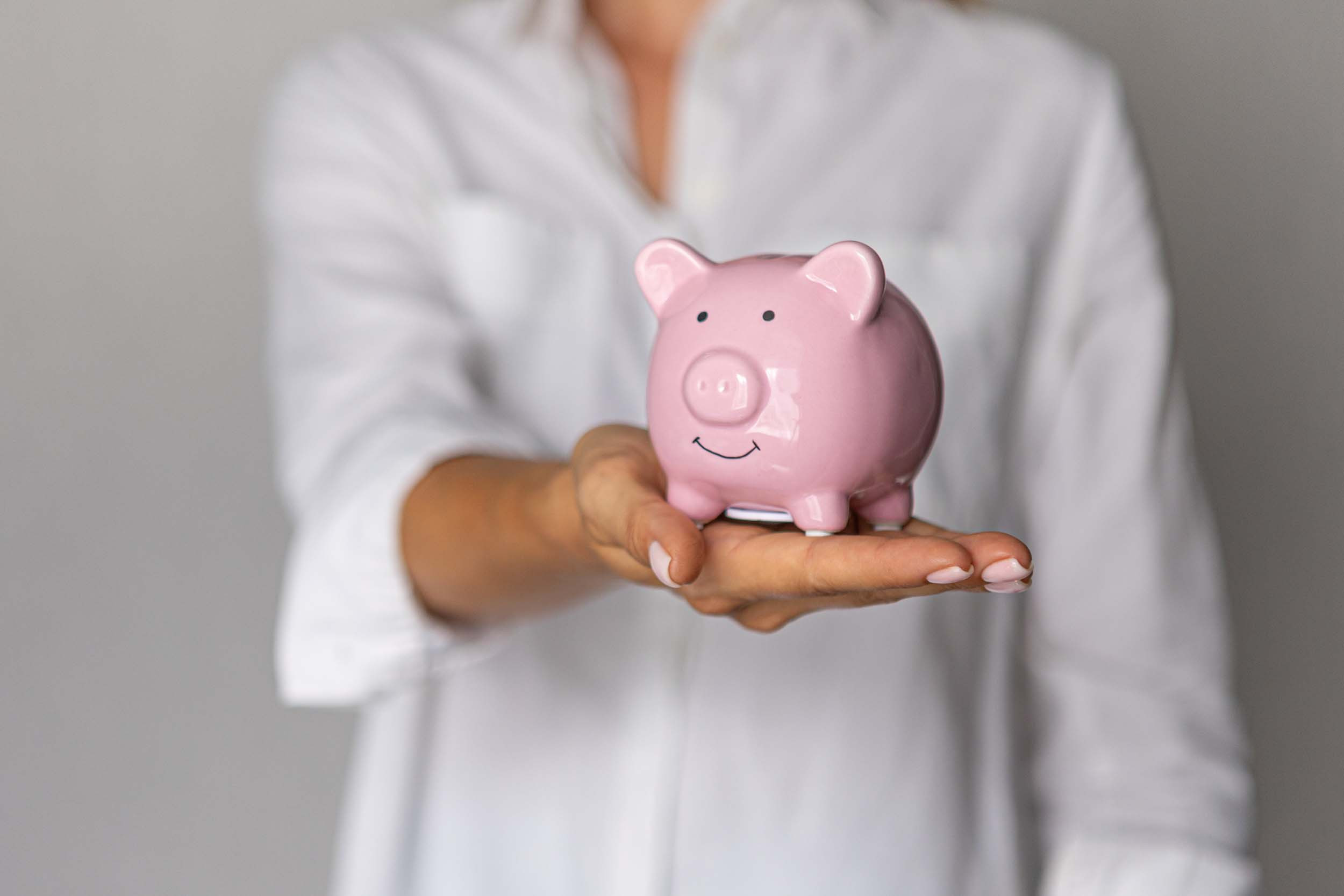 women hands is holding piggybank money cash