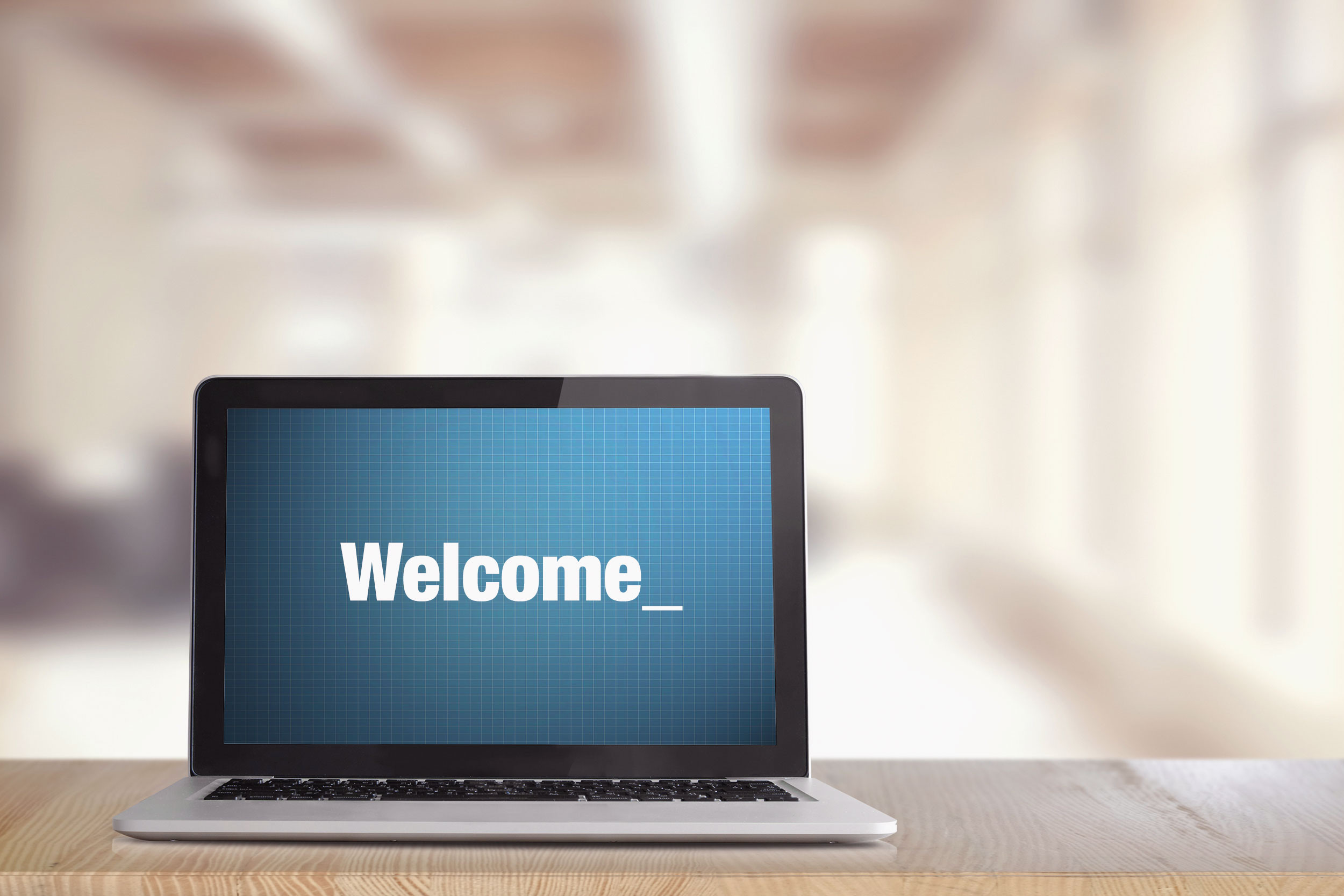laptop welcome screen with desk