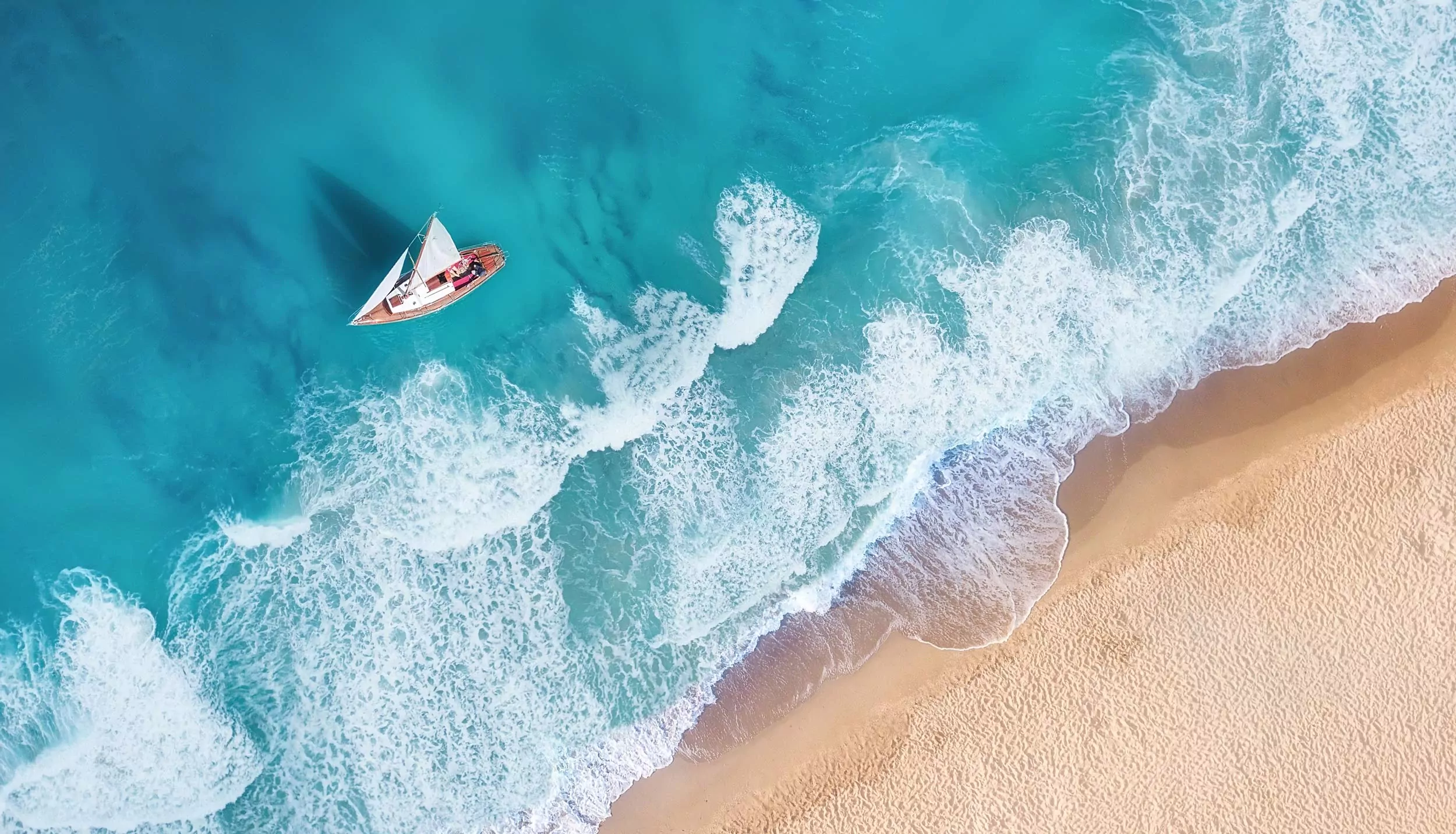 aerial view of sailboat in the seashore