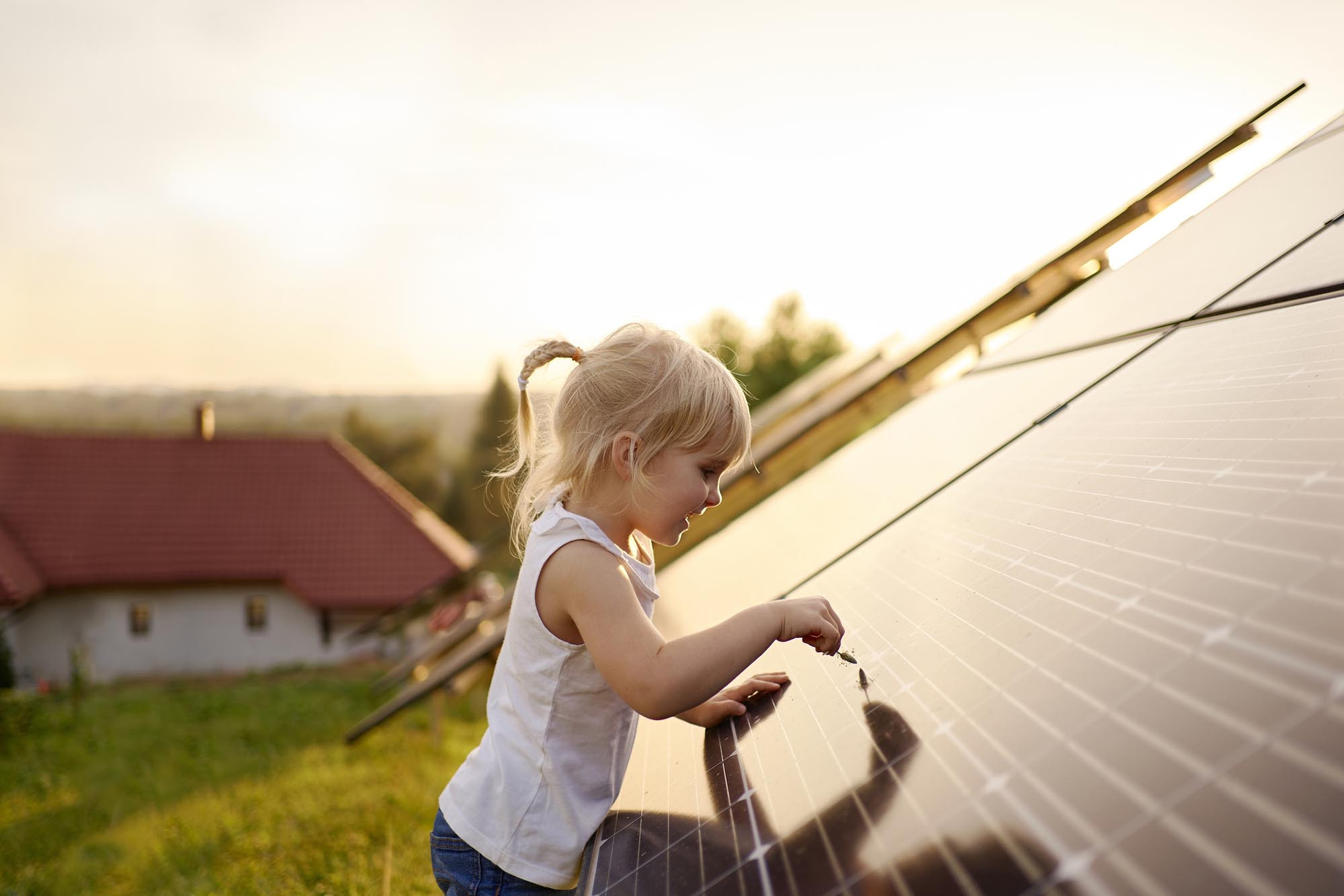 a kid is playing on the solar panel
