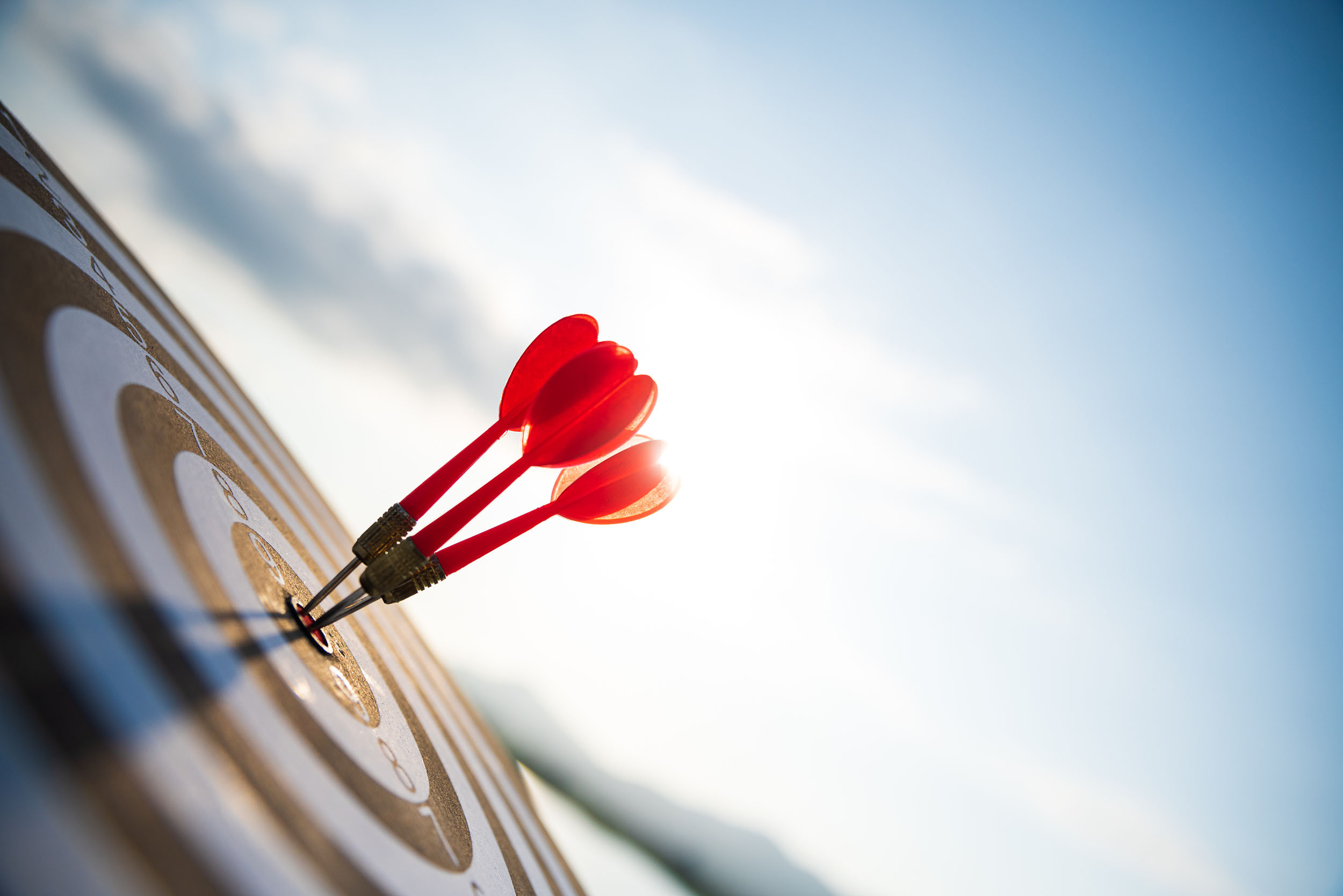 three red arrows marked in the center of dartboard