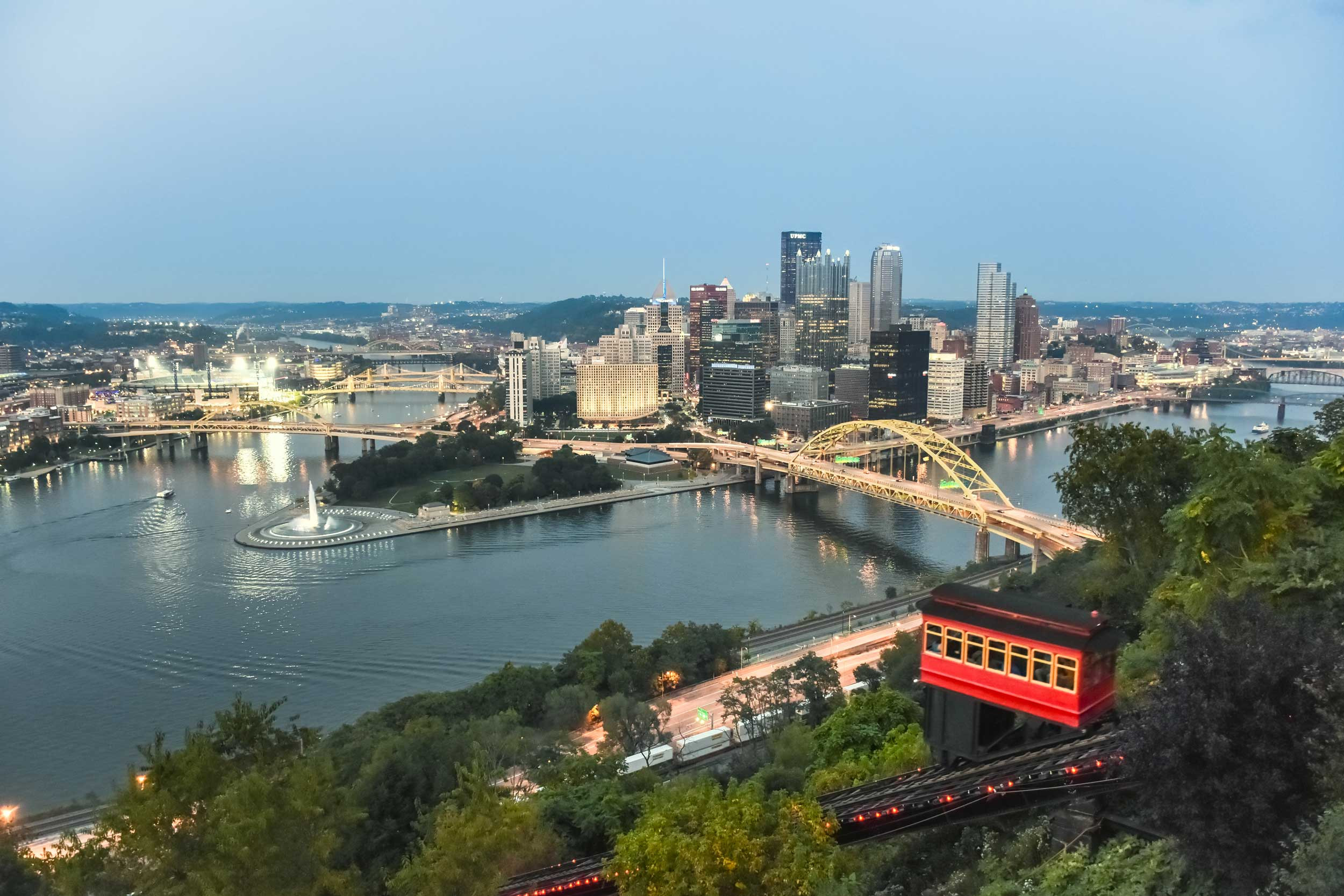 skyline of pittsburg with cable bus in pennsylvania