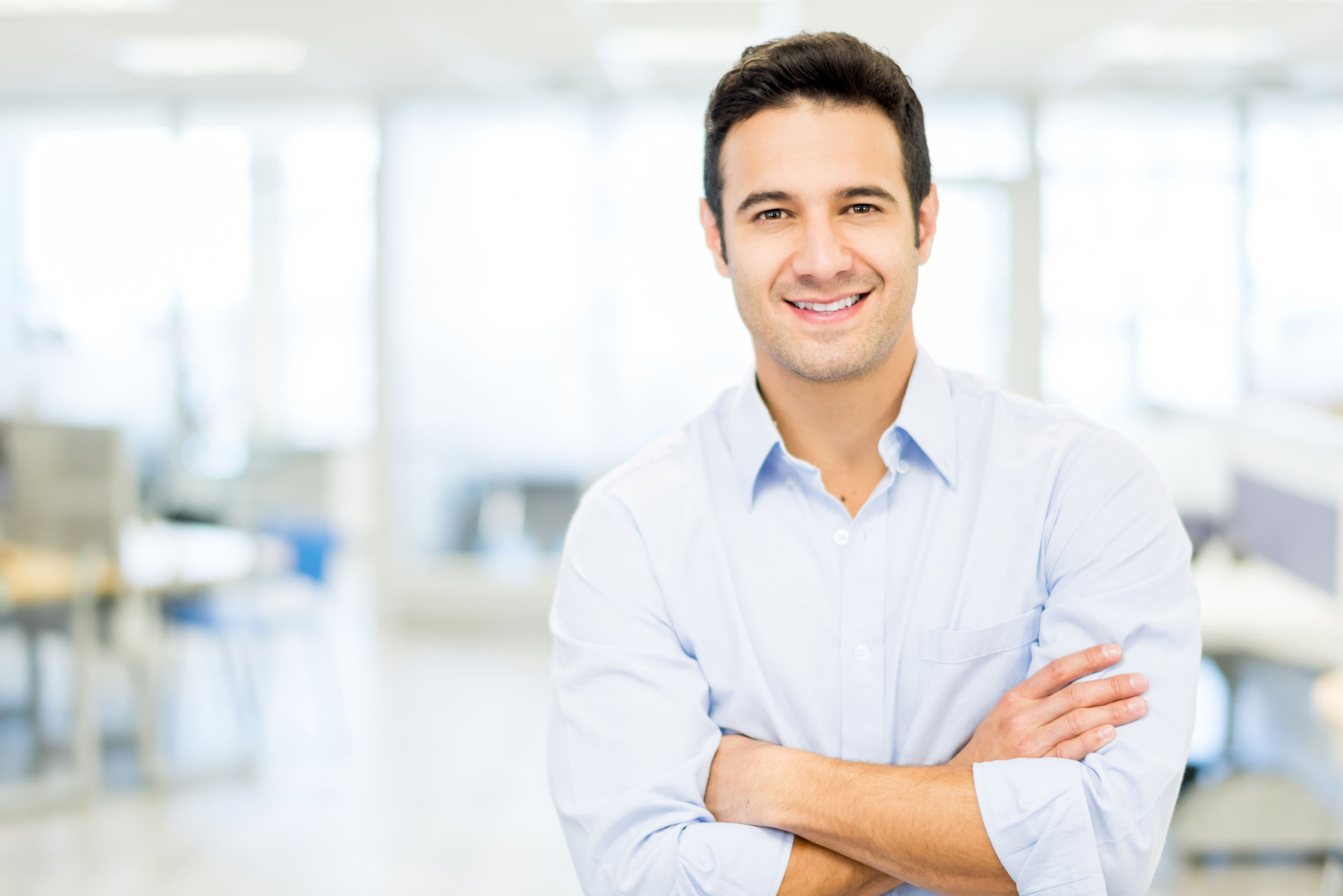 a person standing with the crossing arms
