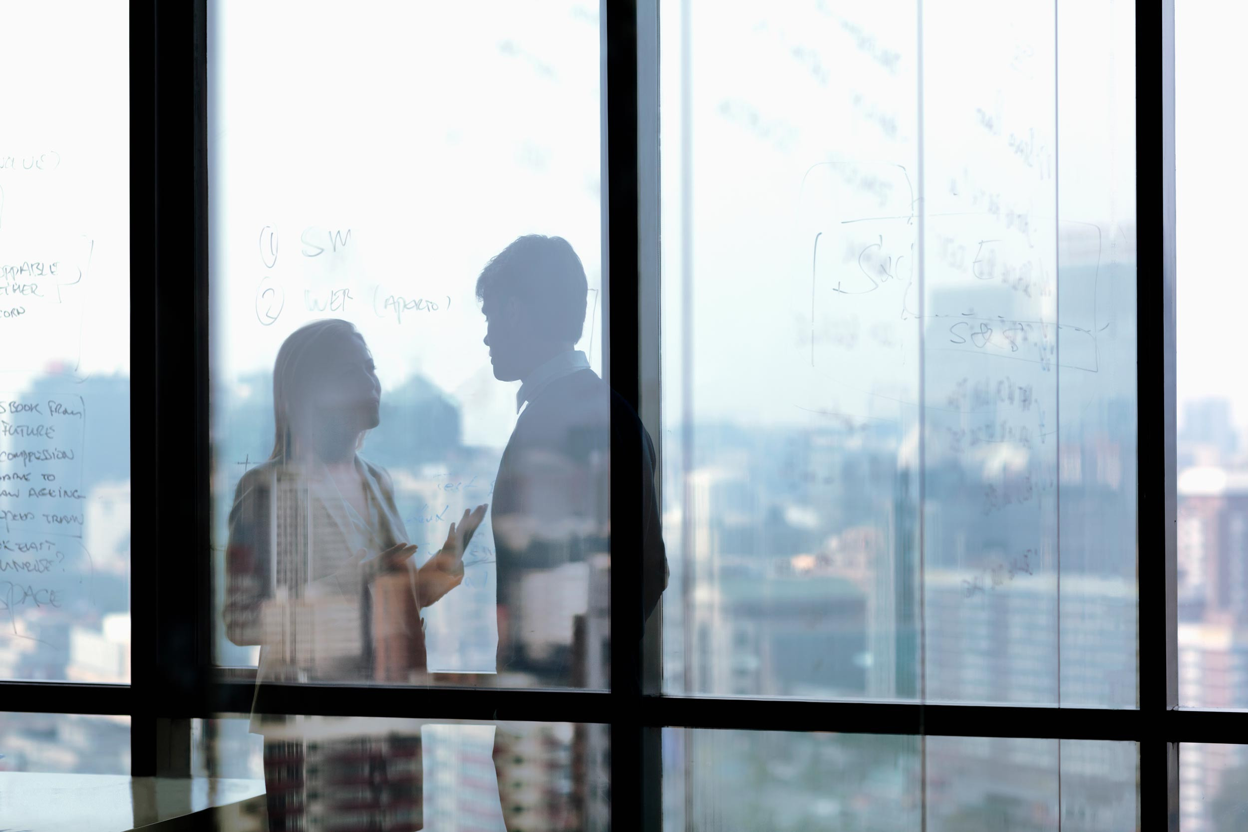 businesspeople talking in office privacy place