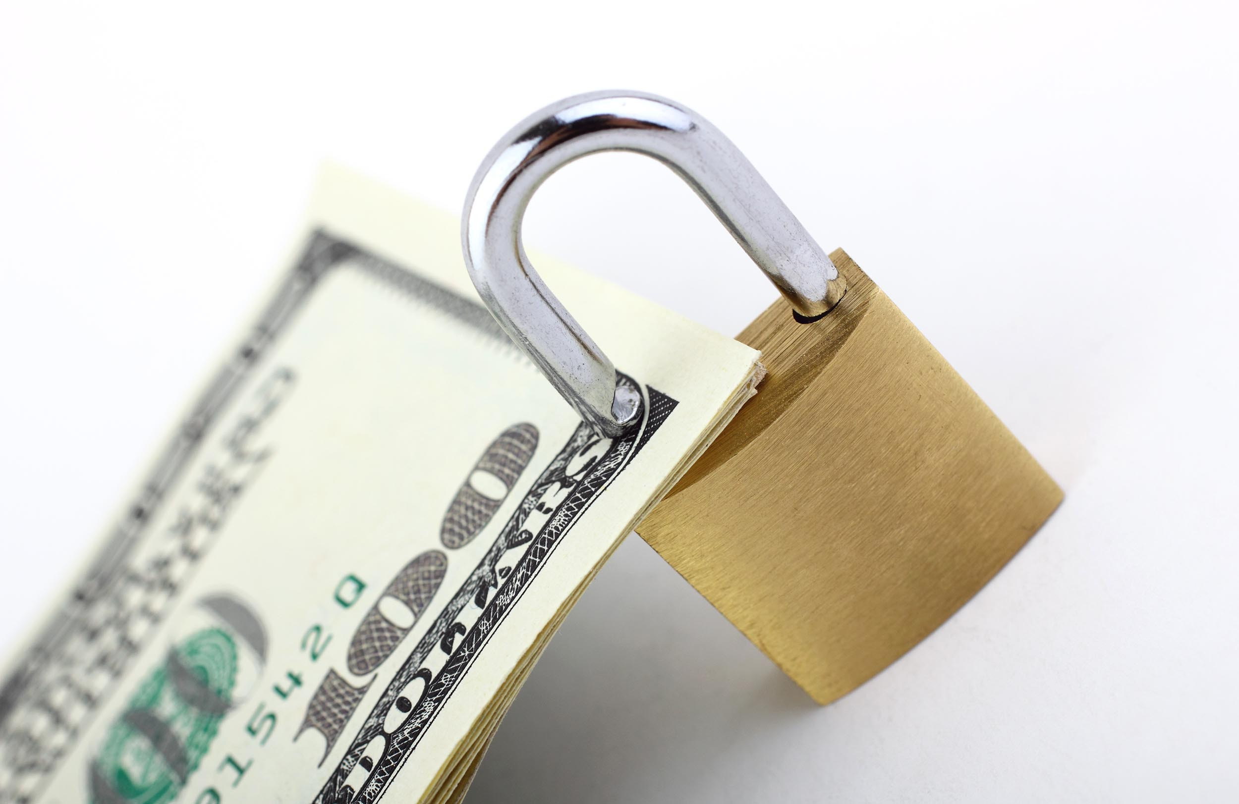 padlock on money with white background