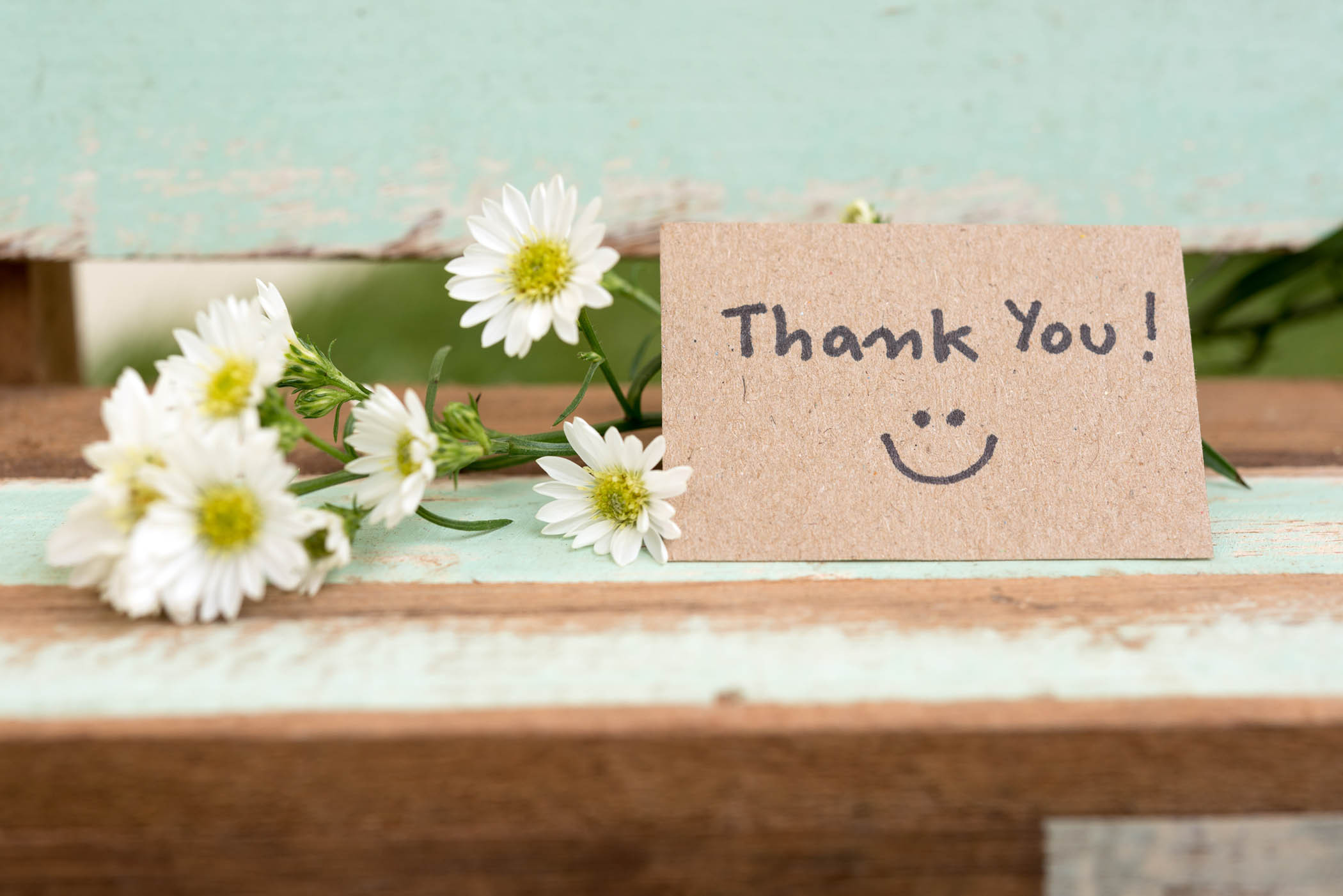 Thank you card with smile face and flower cluster