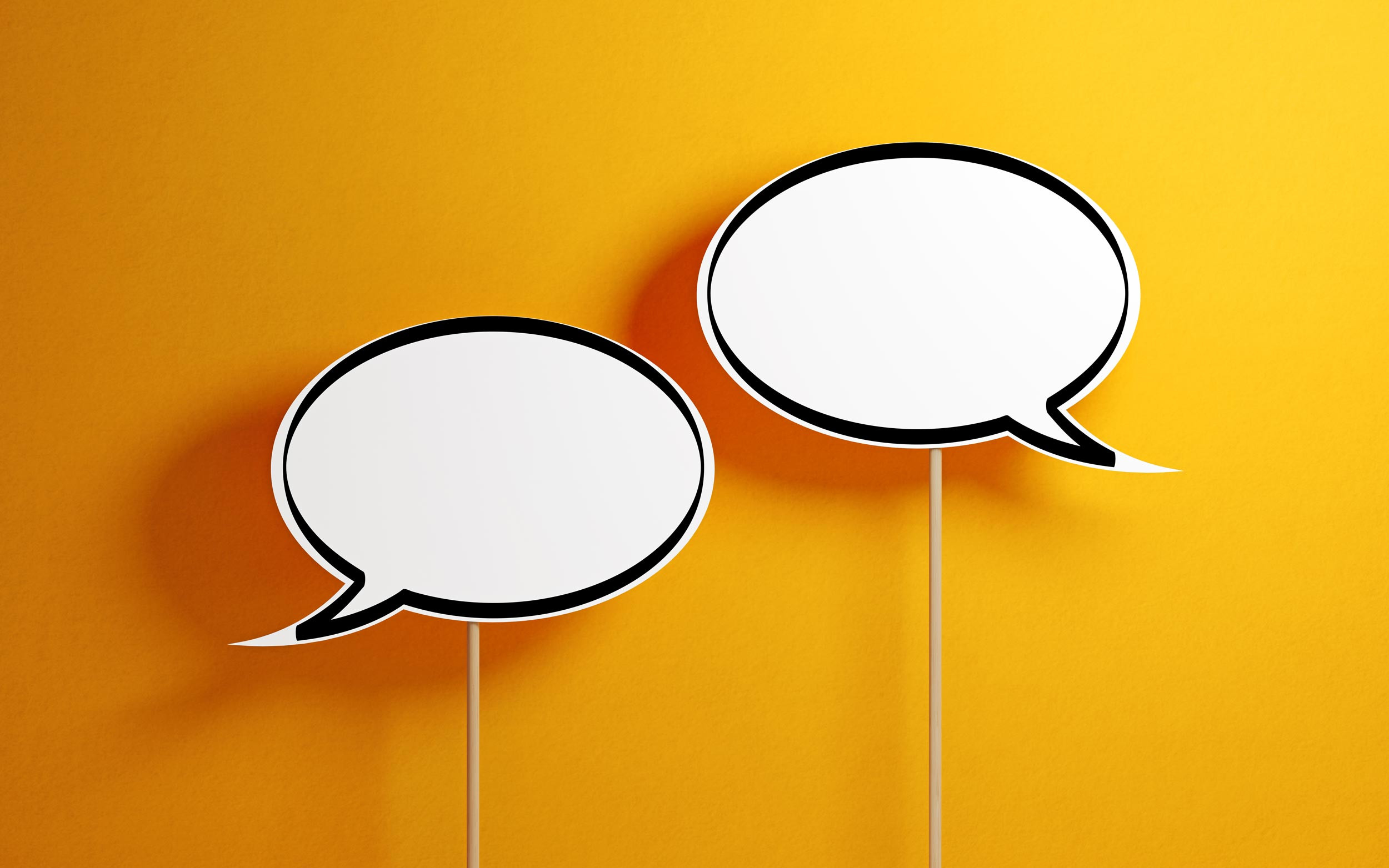 referral speech bubbles with wooden sticks