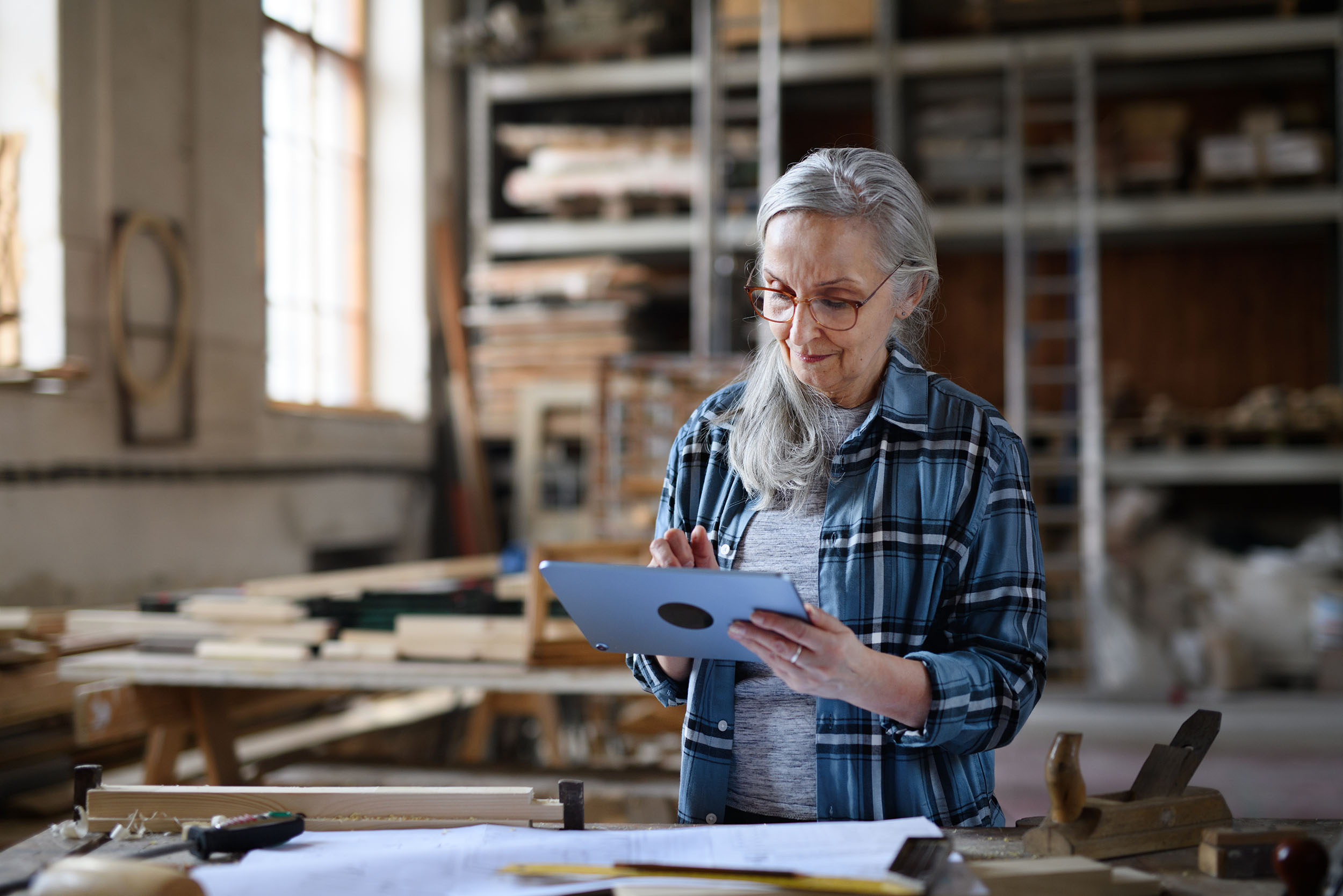 Senior artist working in a studio