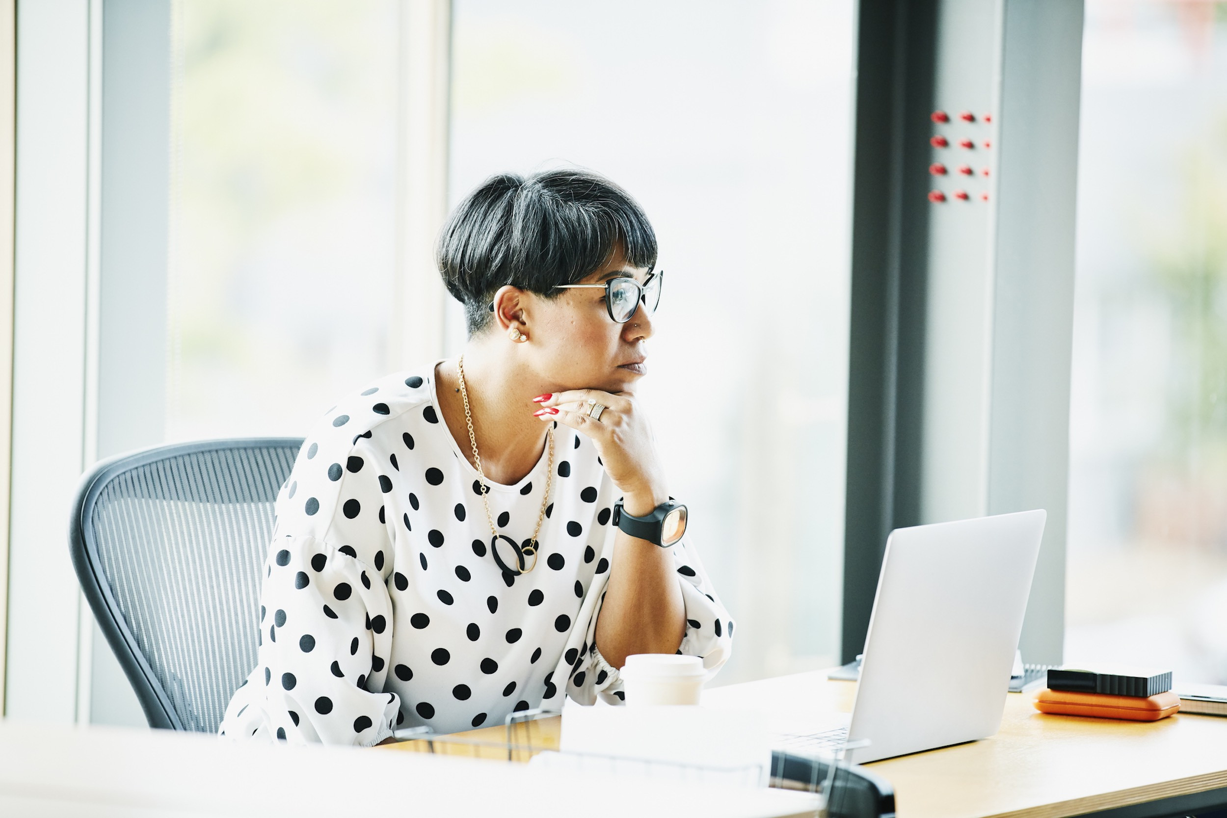 a person focusing at the laptop and working