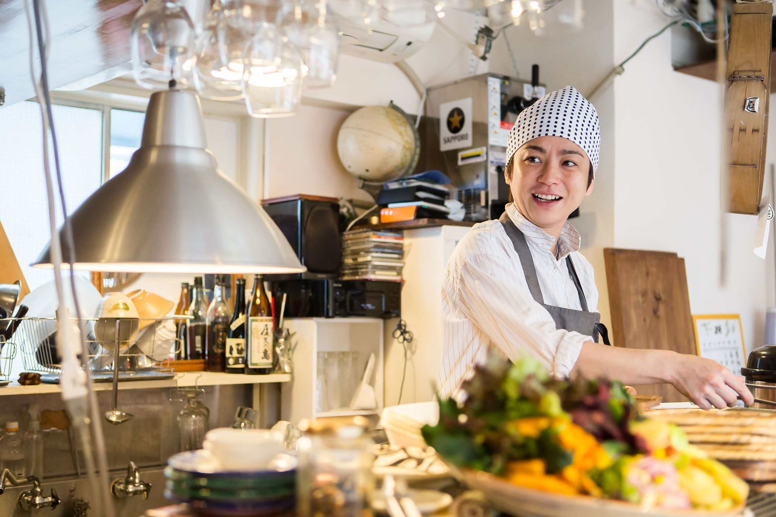 a person cooking food in the small business restaurant